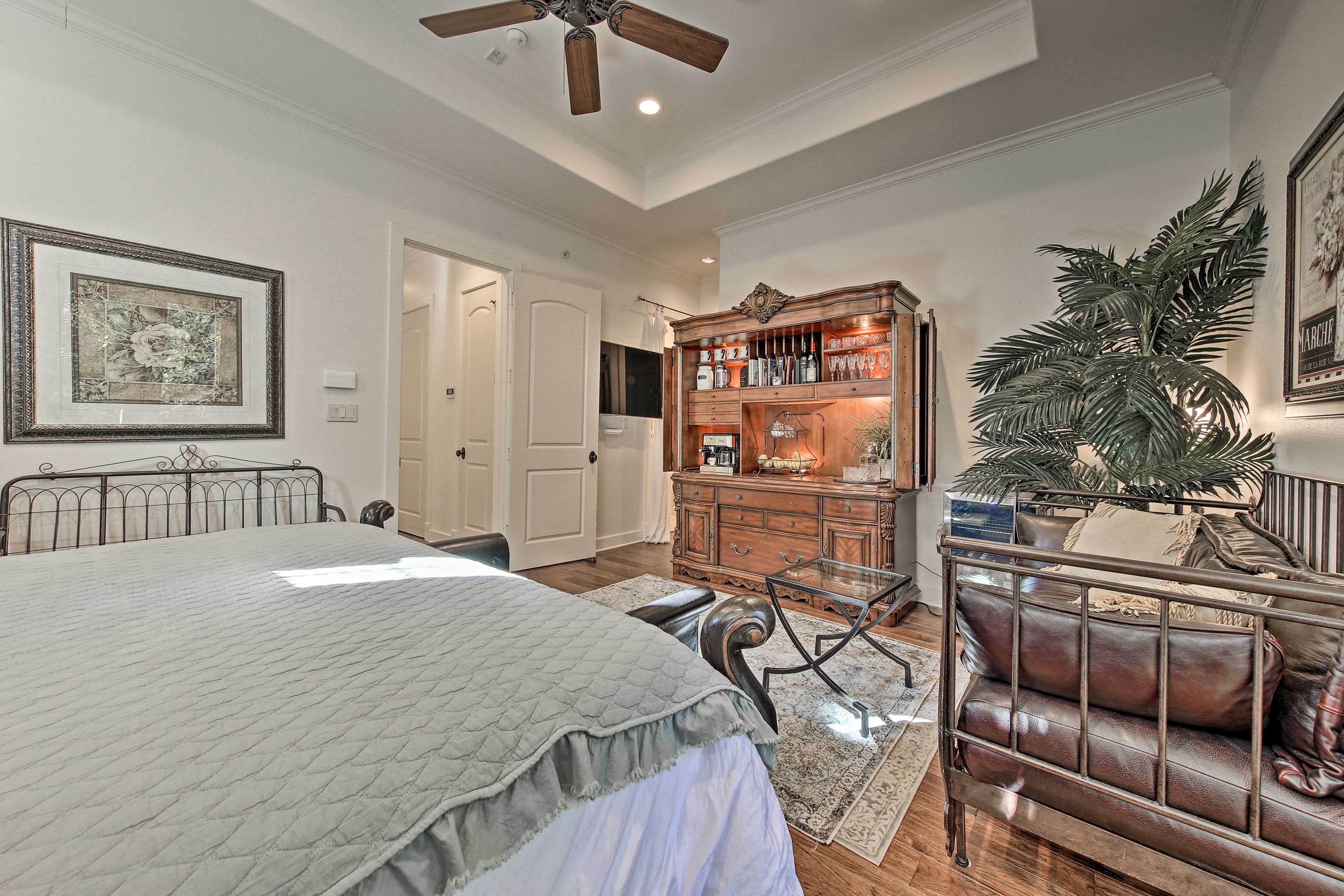This bedroom features it's own couch en suite bathroom and balcony.
