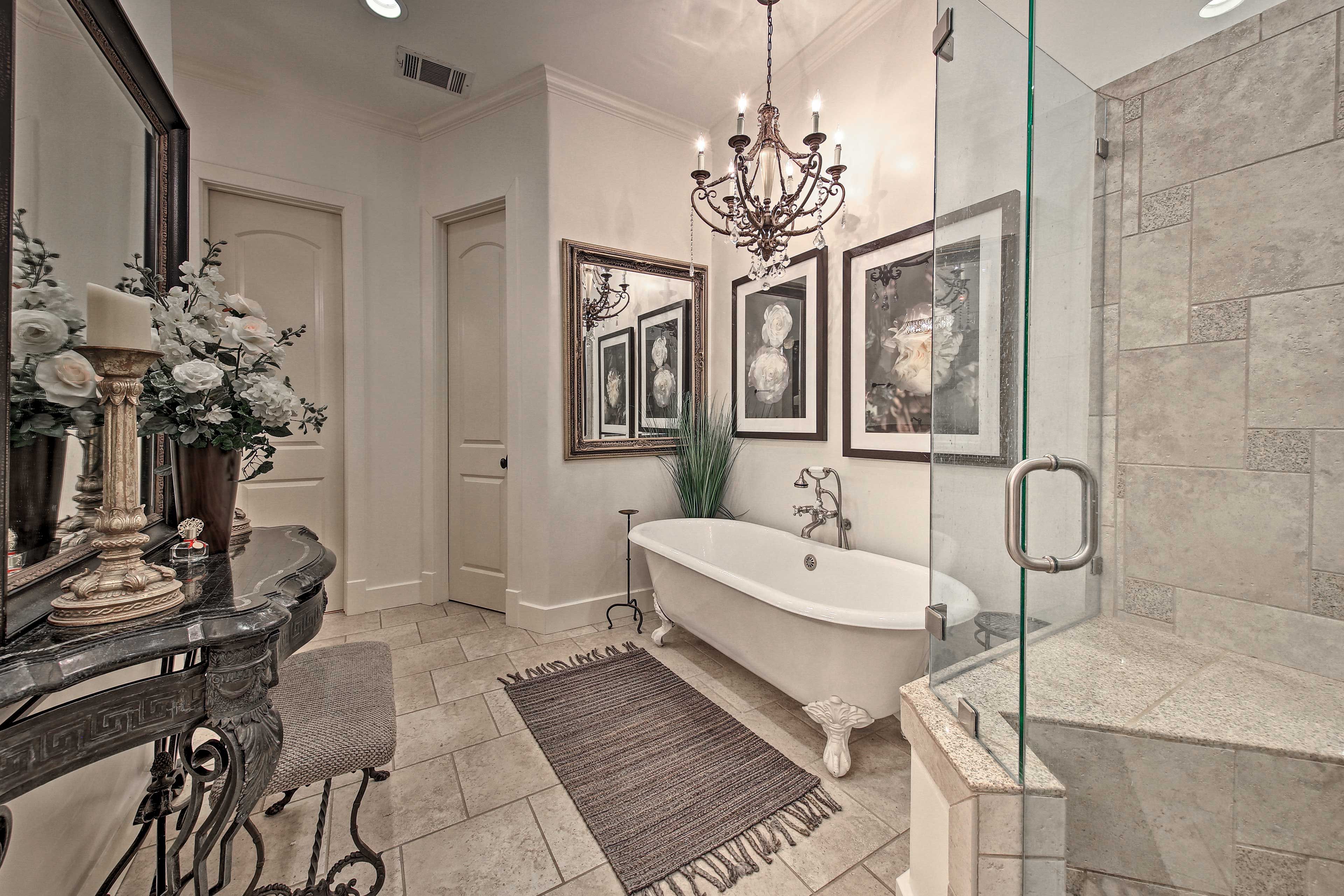 This lavish en-suite bath is home to both a walk in shower and footed tub.