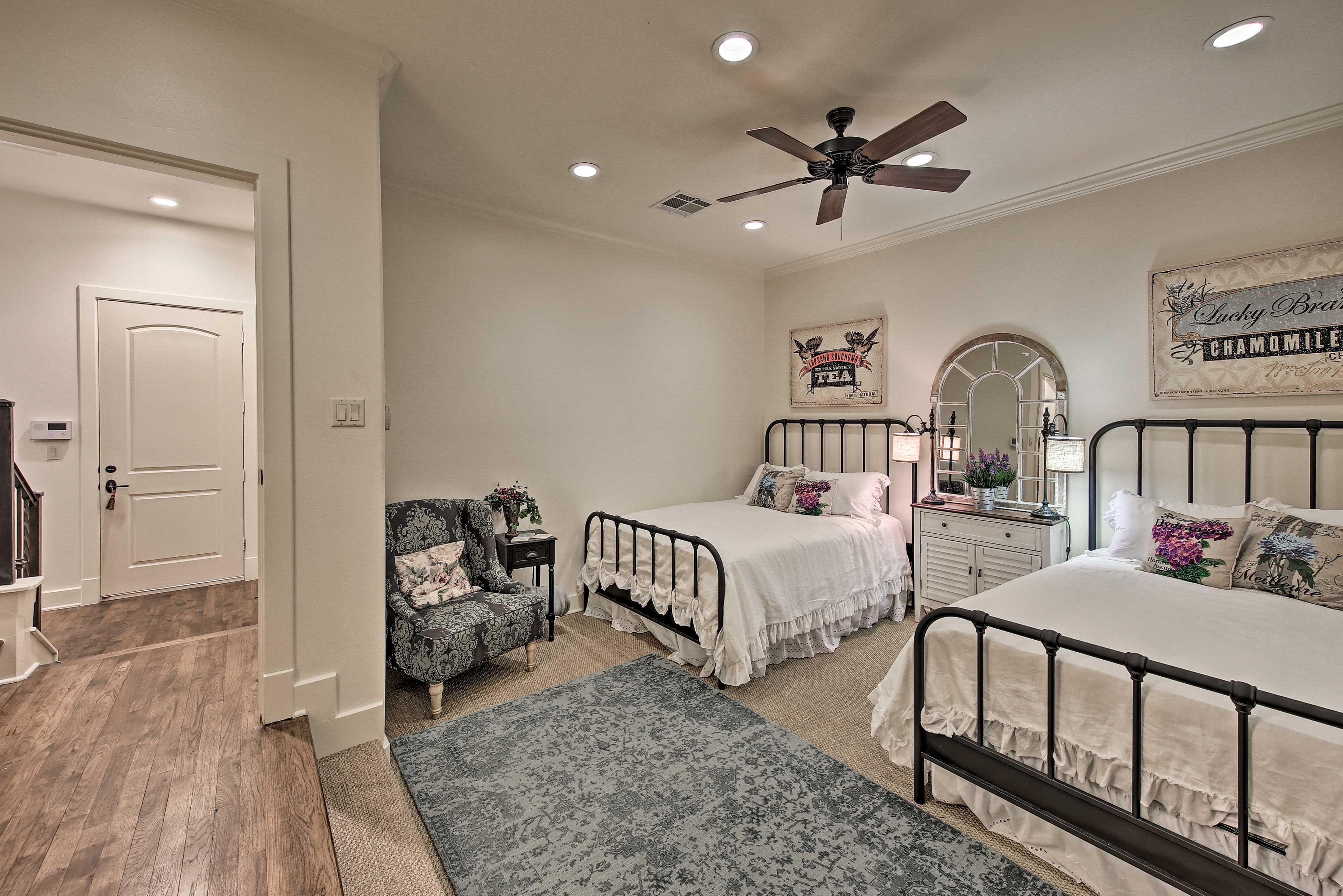This first level bedroom is home to two cozy queen beds.