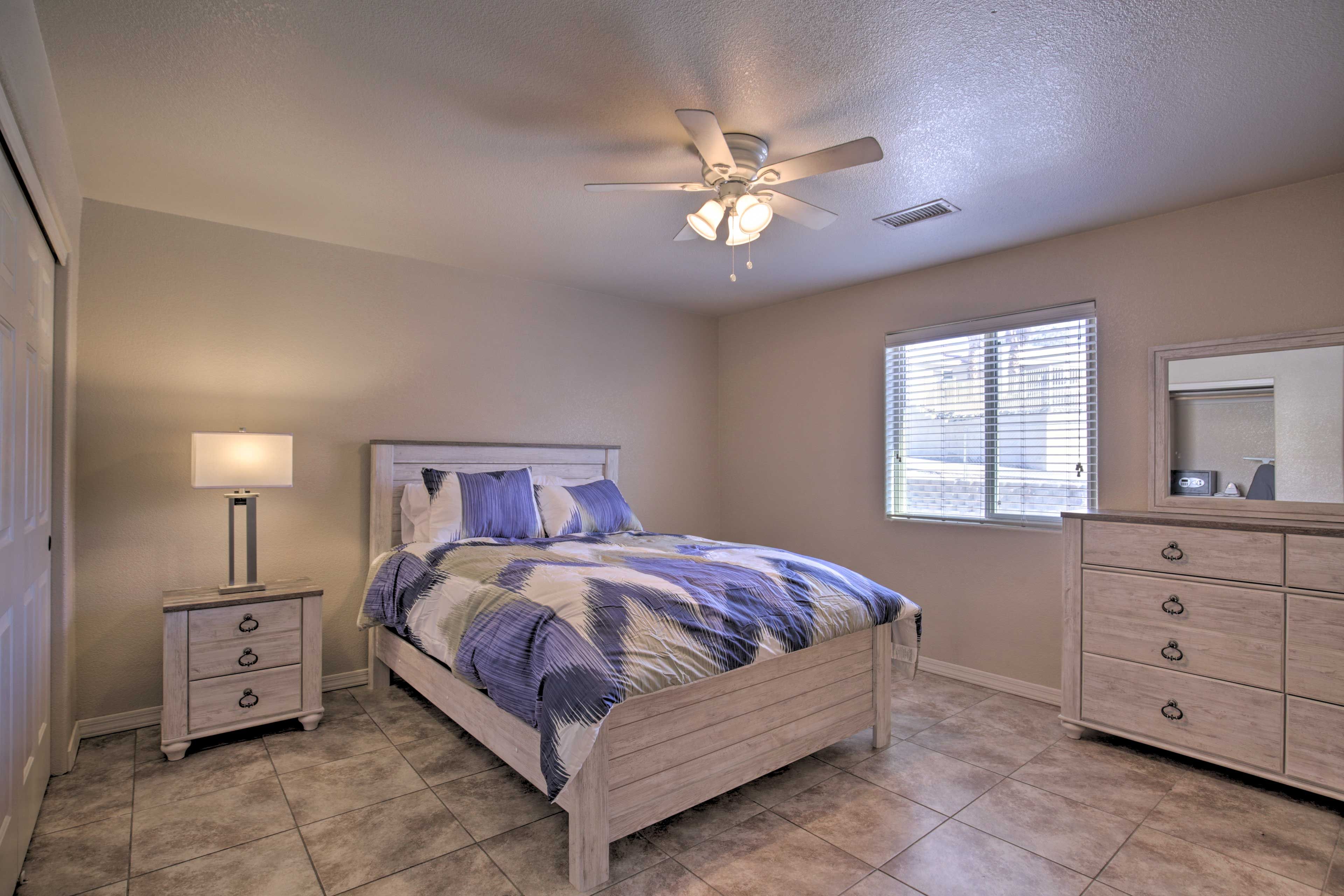 The first bedroom features a queen-sized bed.