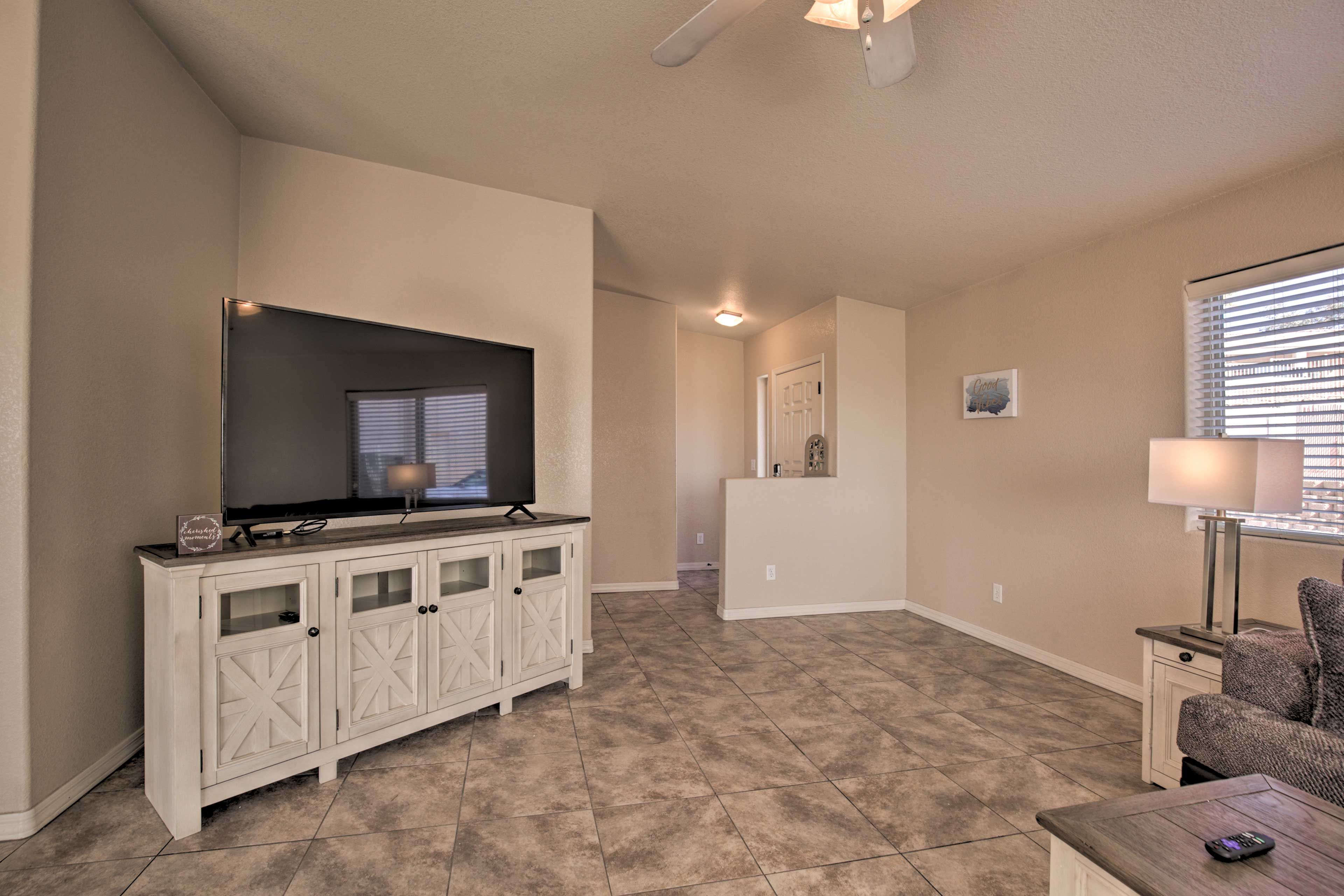 Watch a movie on this flat-screen TV with Netflix and Disney+.