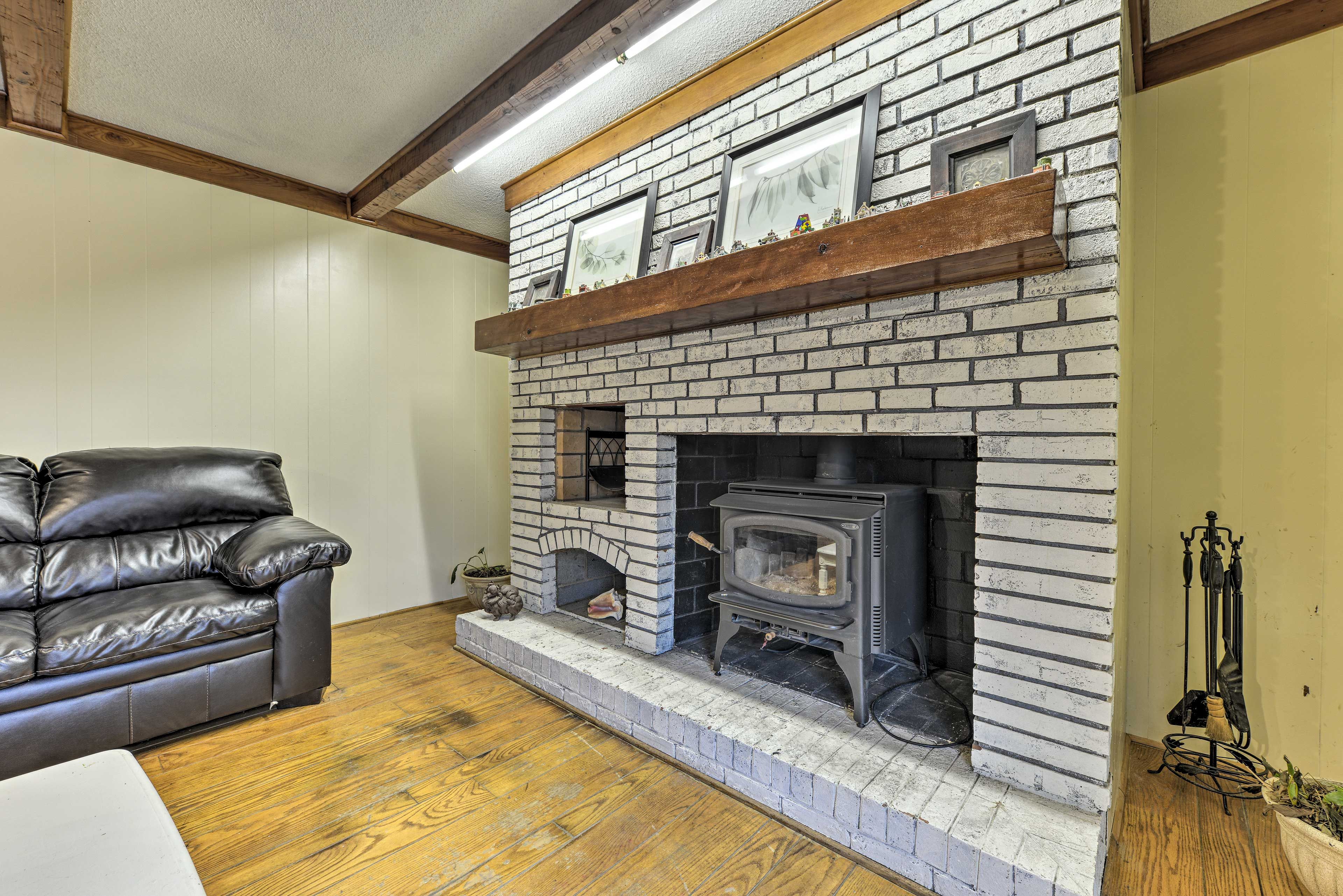 Throw some wood on the fireplace downstairs and warm up in colder months!