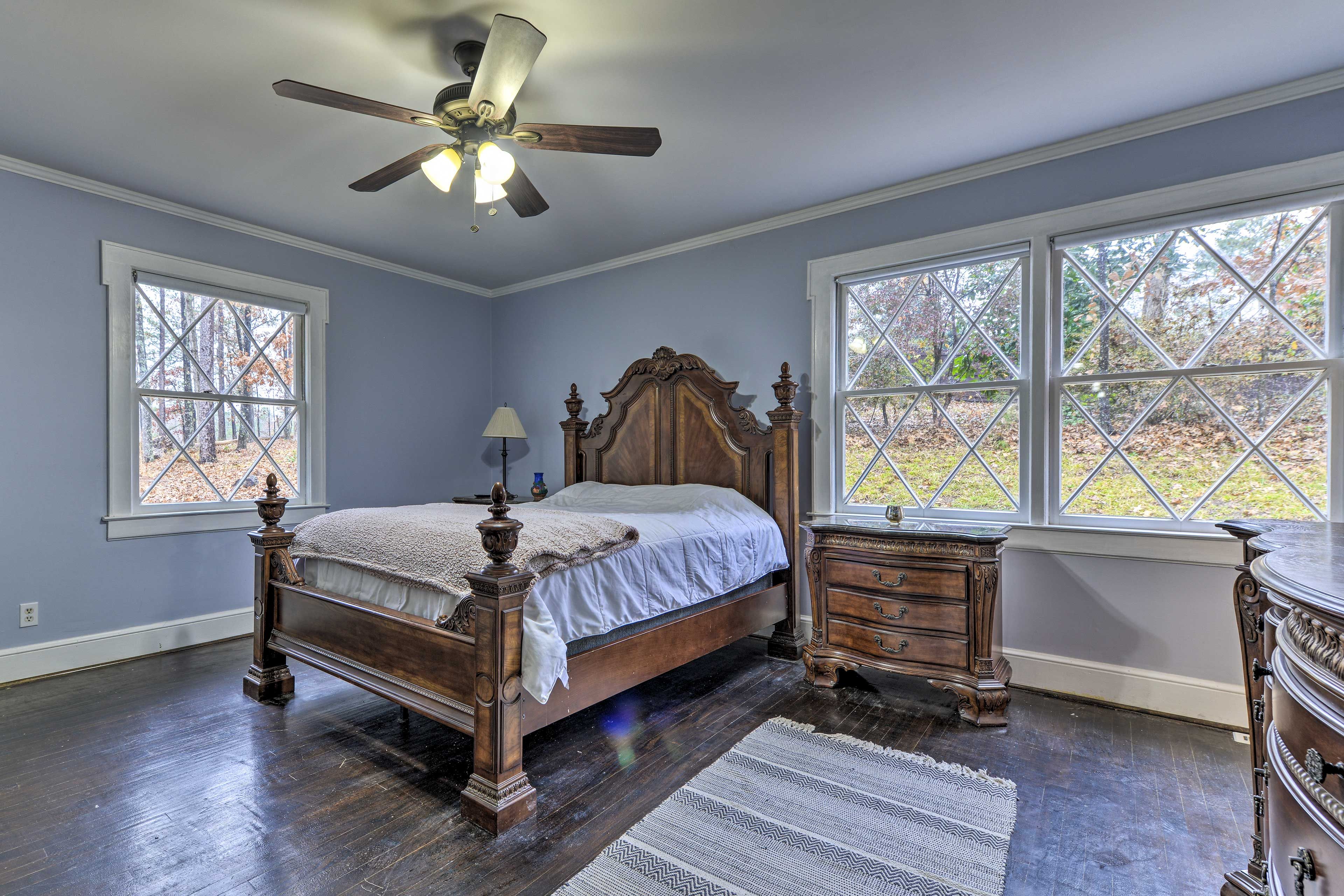 Lay your head down after a long day on this plush queen bed.