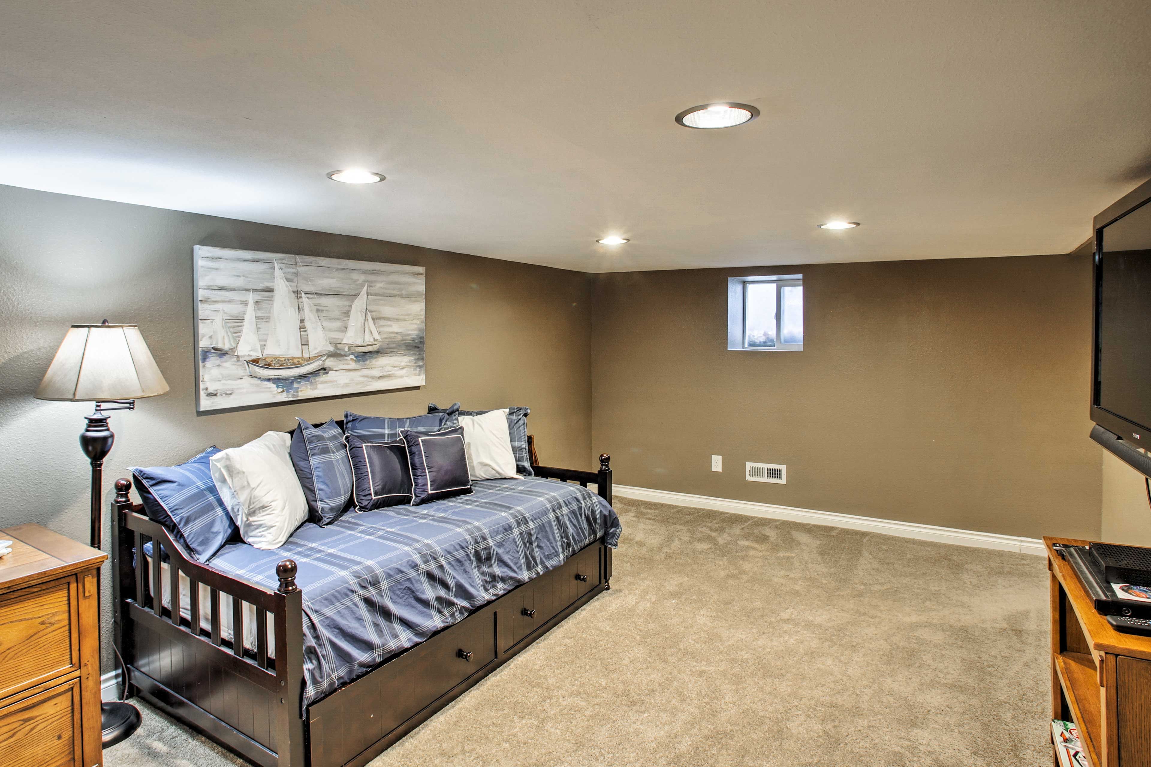 The Rec Room doubles as a sleeping space with this twin daybed & twin trundle.