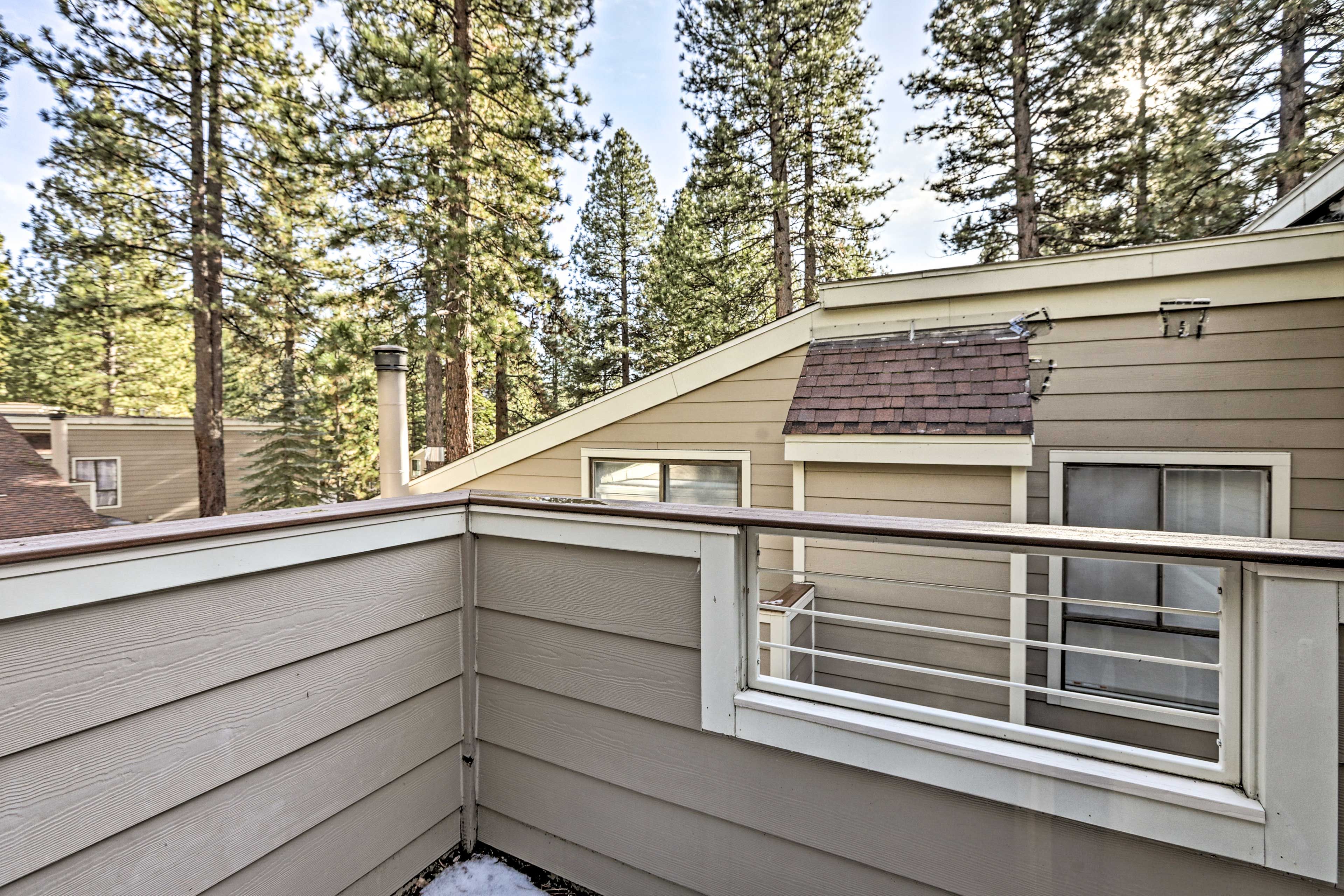 Take in the wooded views from the deck.