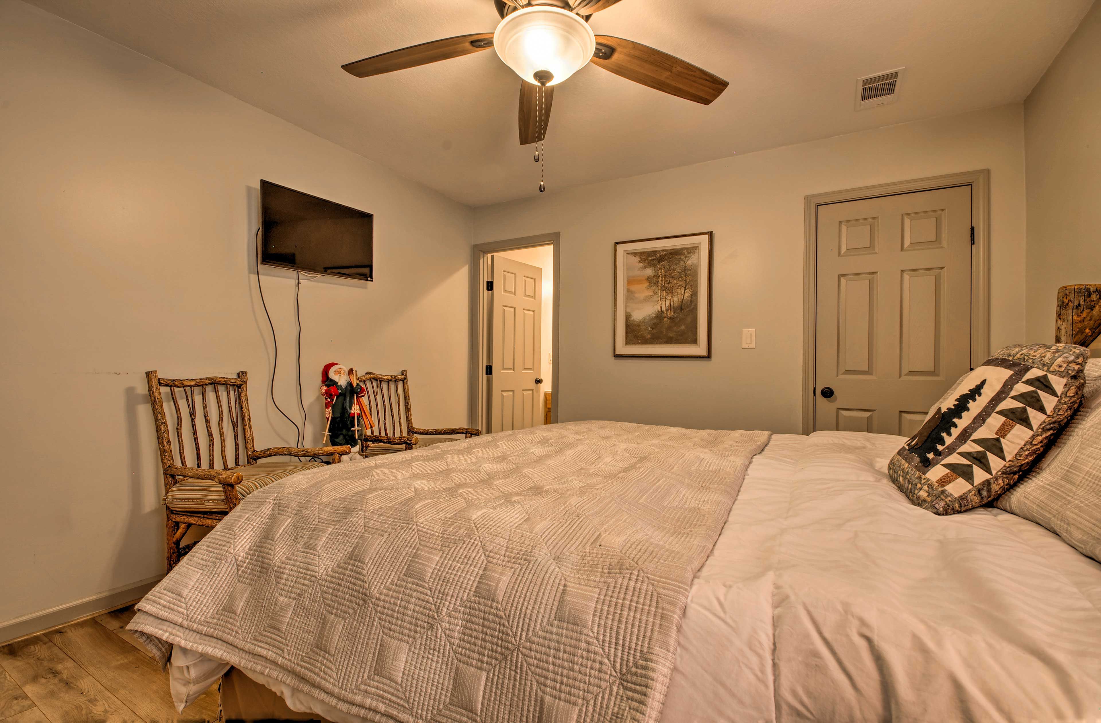 There's also a flat-screen TV, storage space, and an en-suite bathroom.