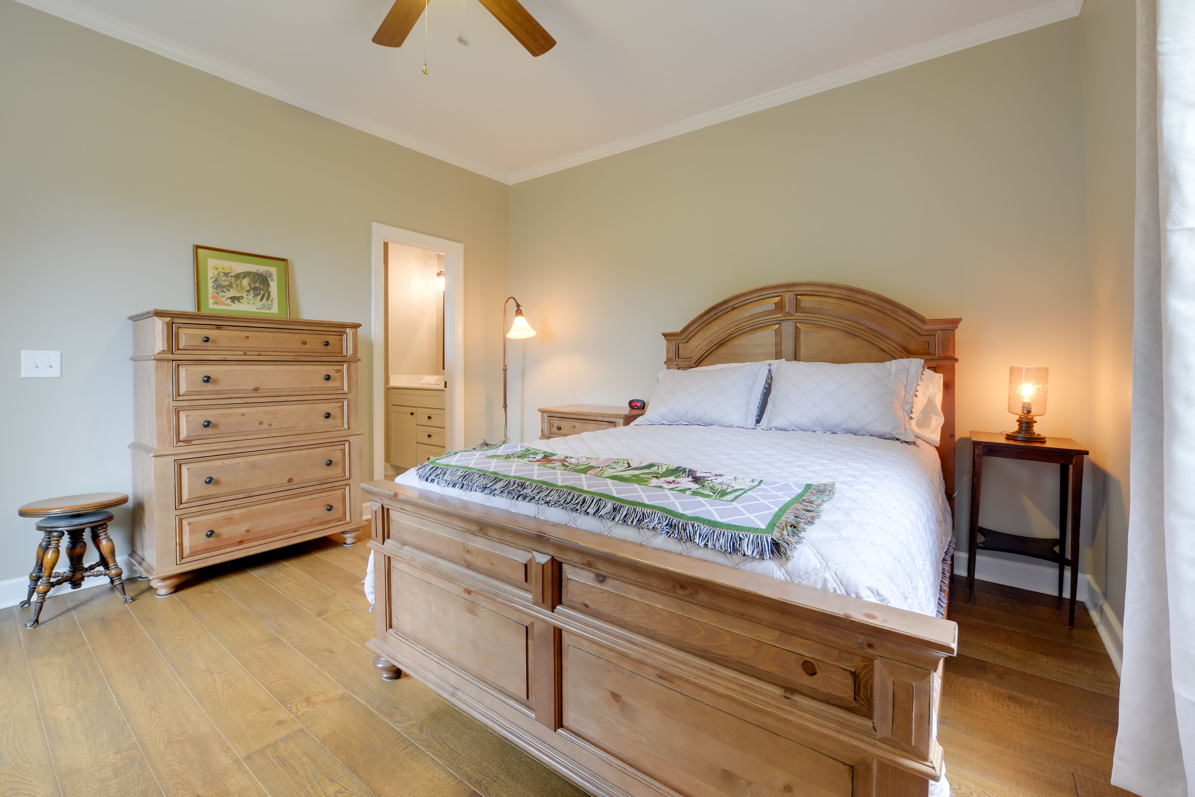 Retire to the primary bedroom and this queen-sized bed.