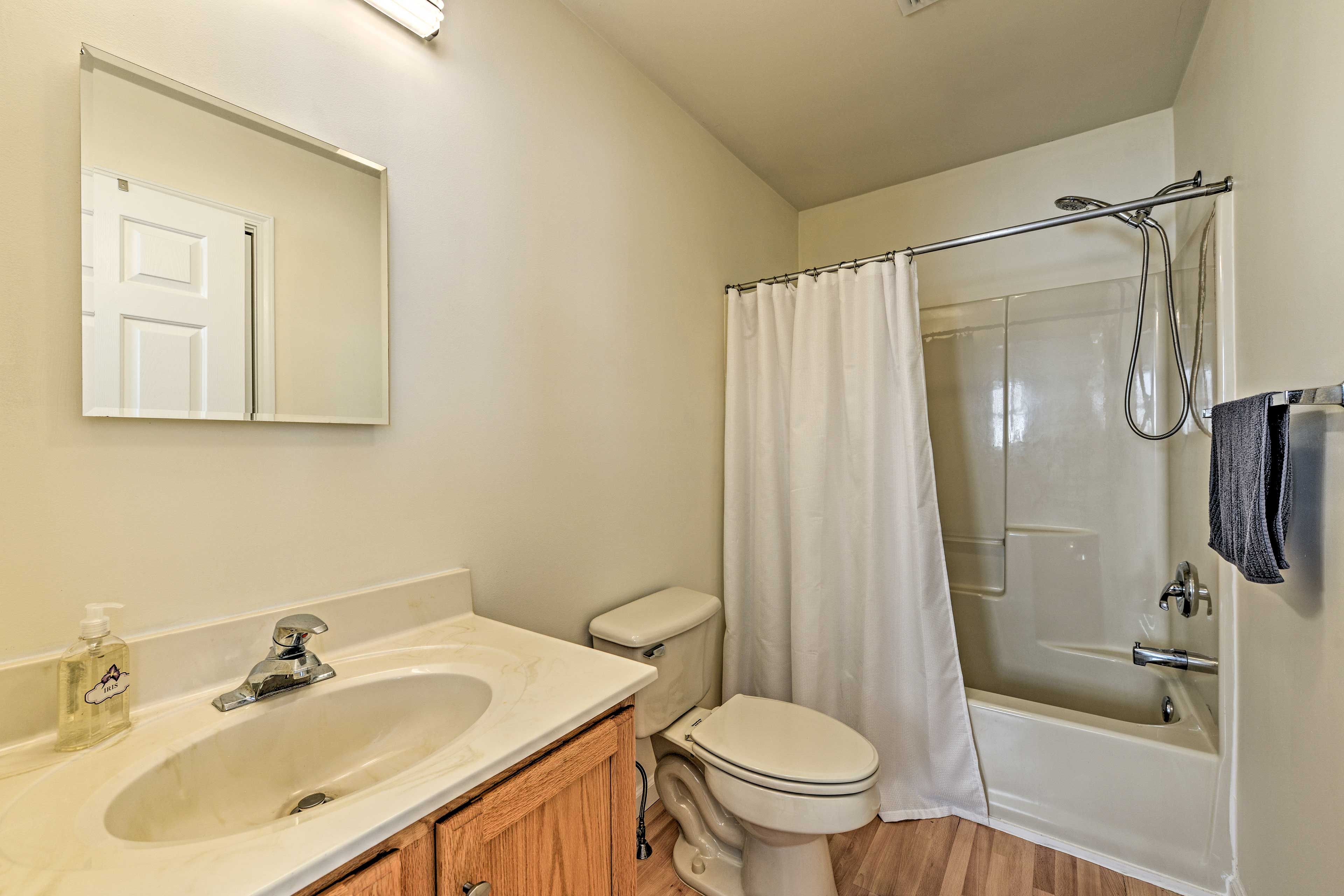The first full bath is equipped with a shower/tub combo.
