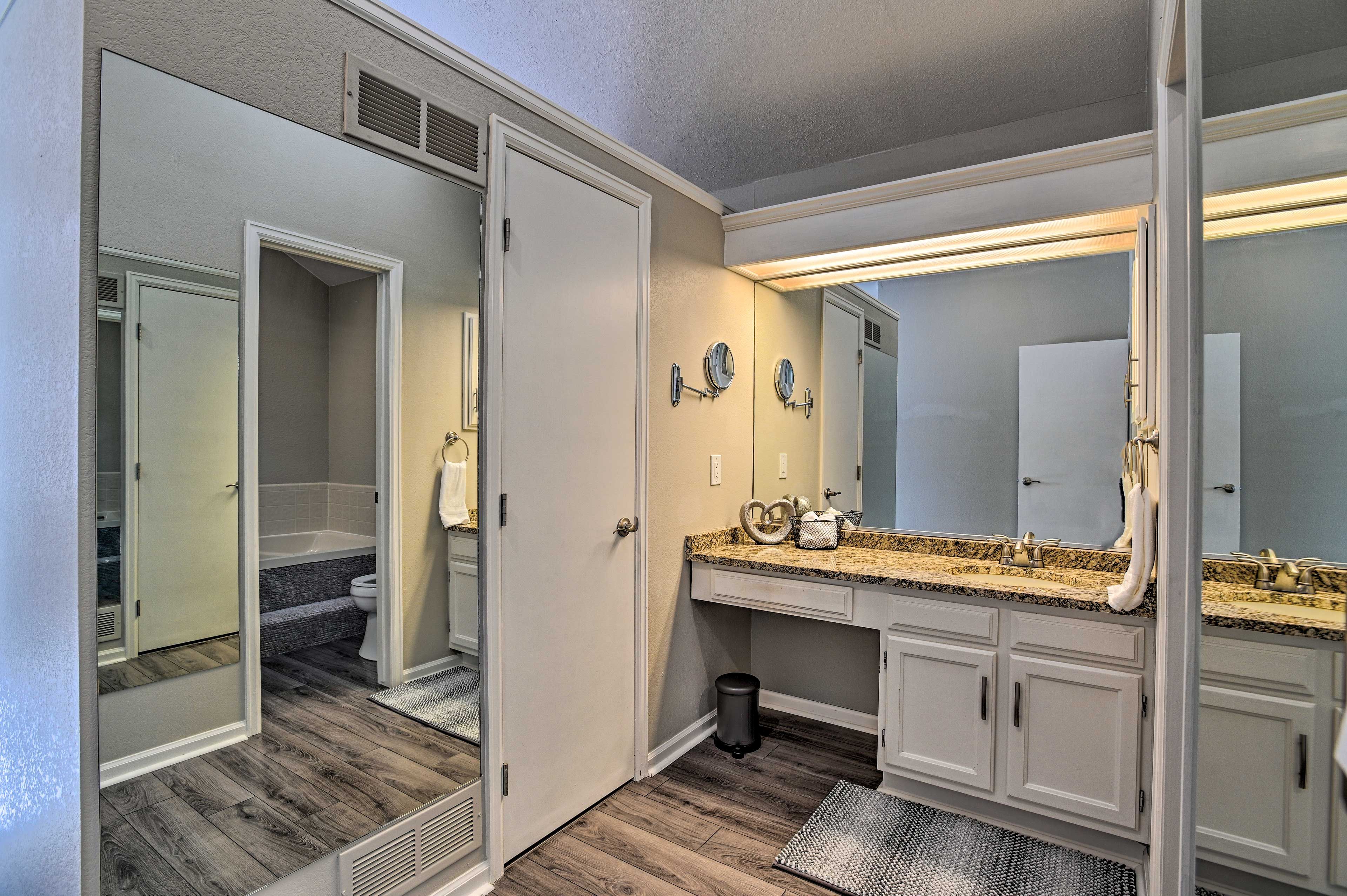 The large bath includes a large sink vanity.