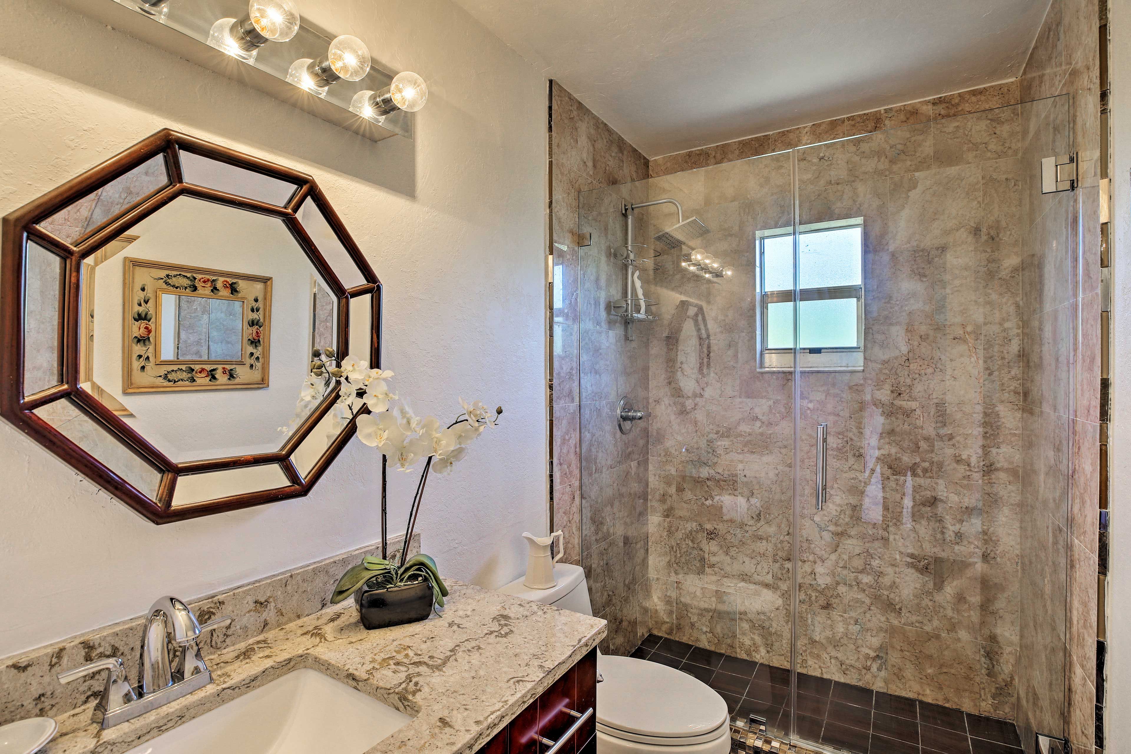 The second bathroom also features a sleek walk-in shower.