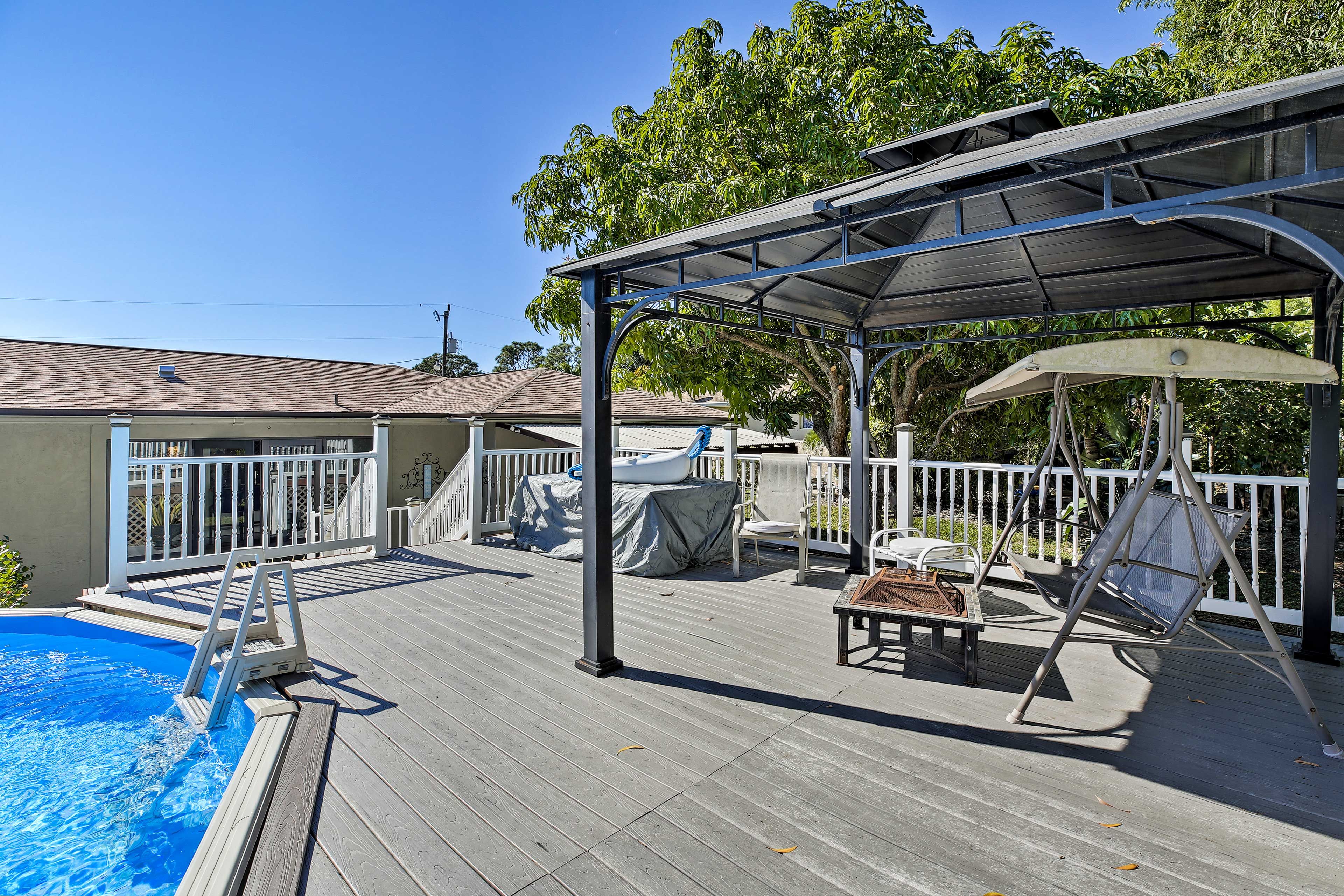 On the raised deck you'll find a gazebo, fire pit, porch swing and the pool!