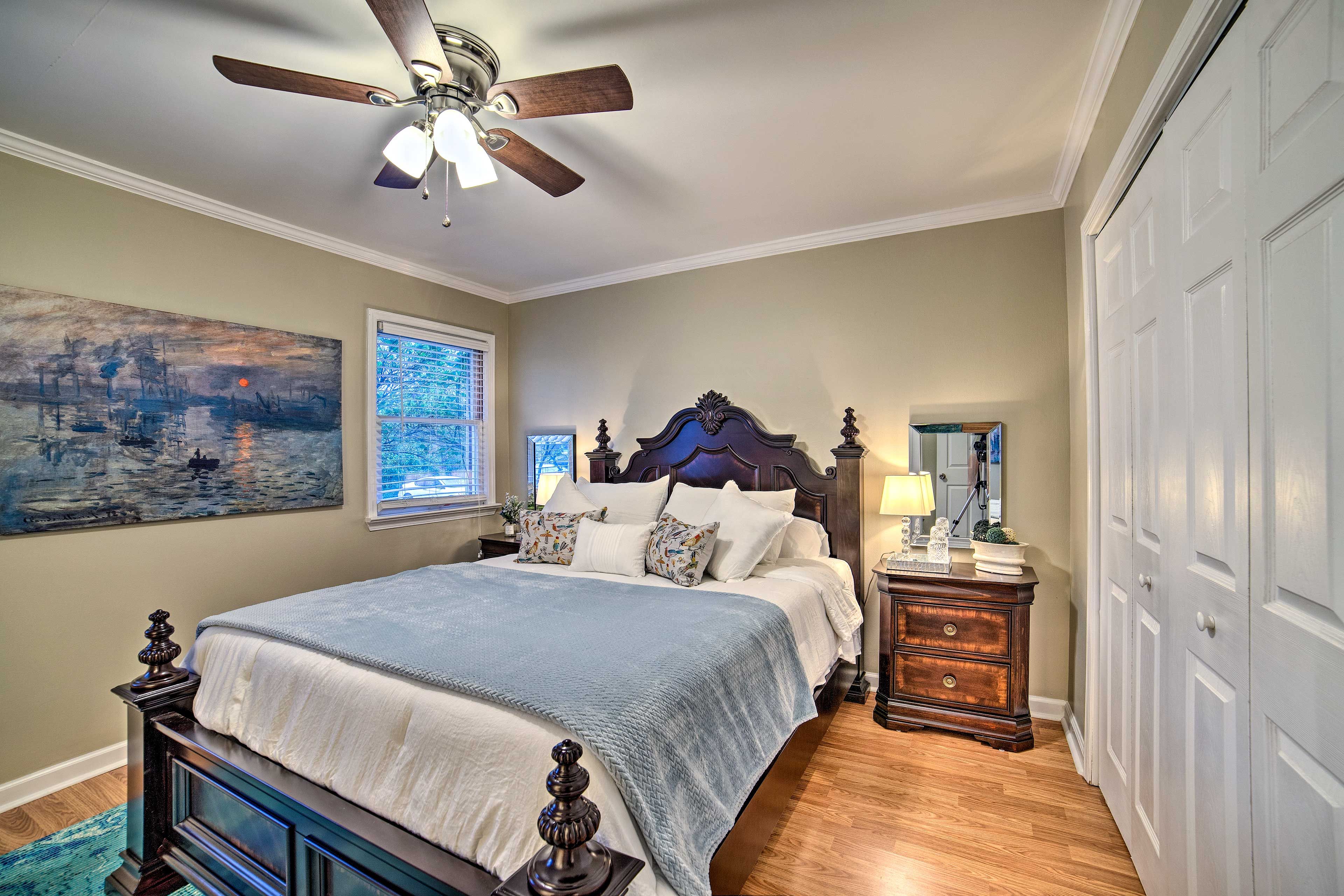 The room boasts a queen bed.