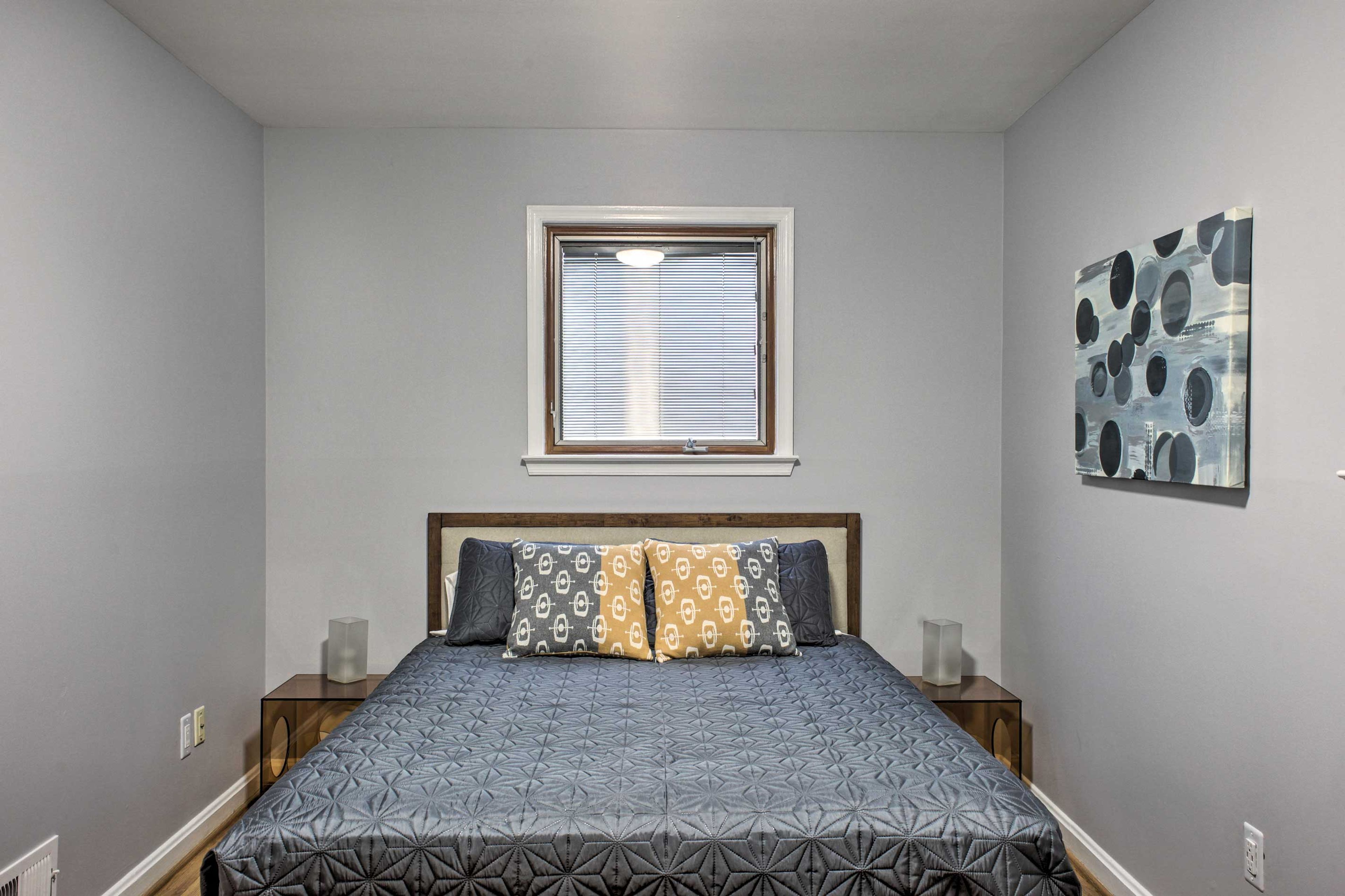 This bedroom features a queen bed.
