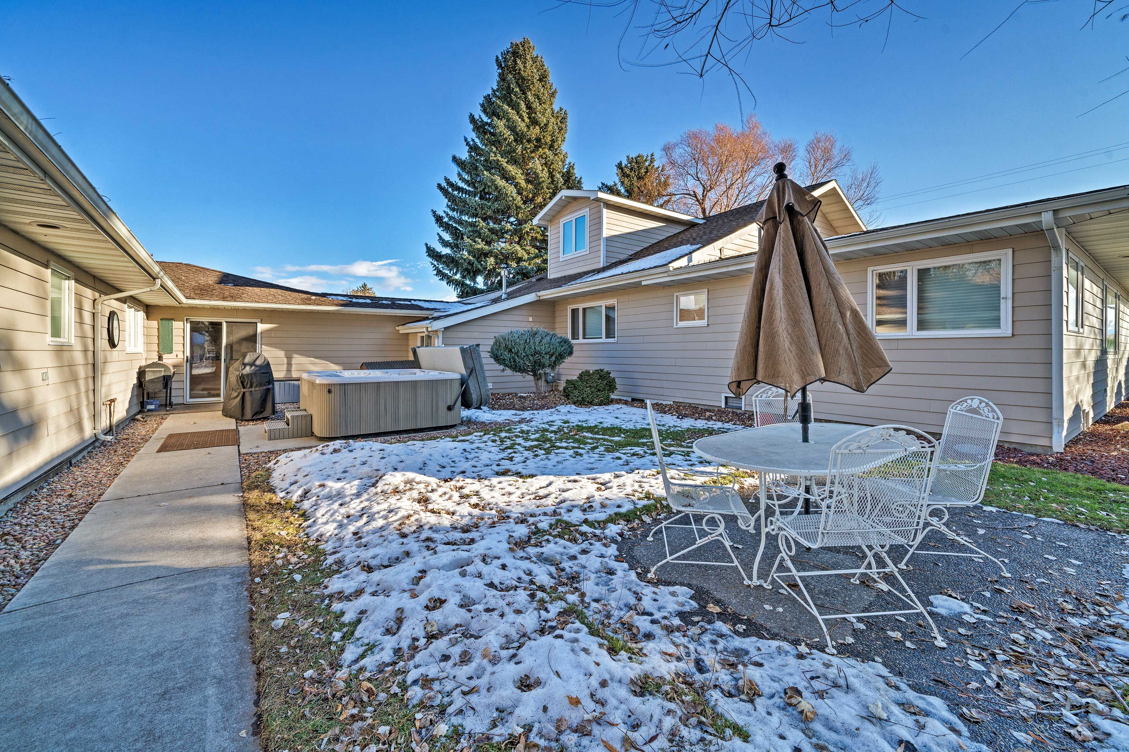 Enjoy a meal on the outdoor dining table in the warmer months.