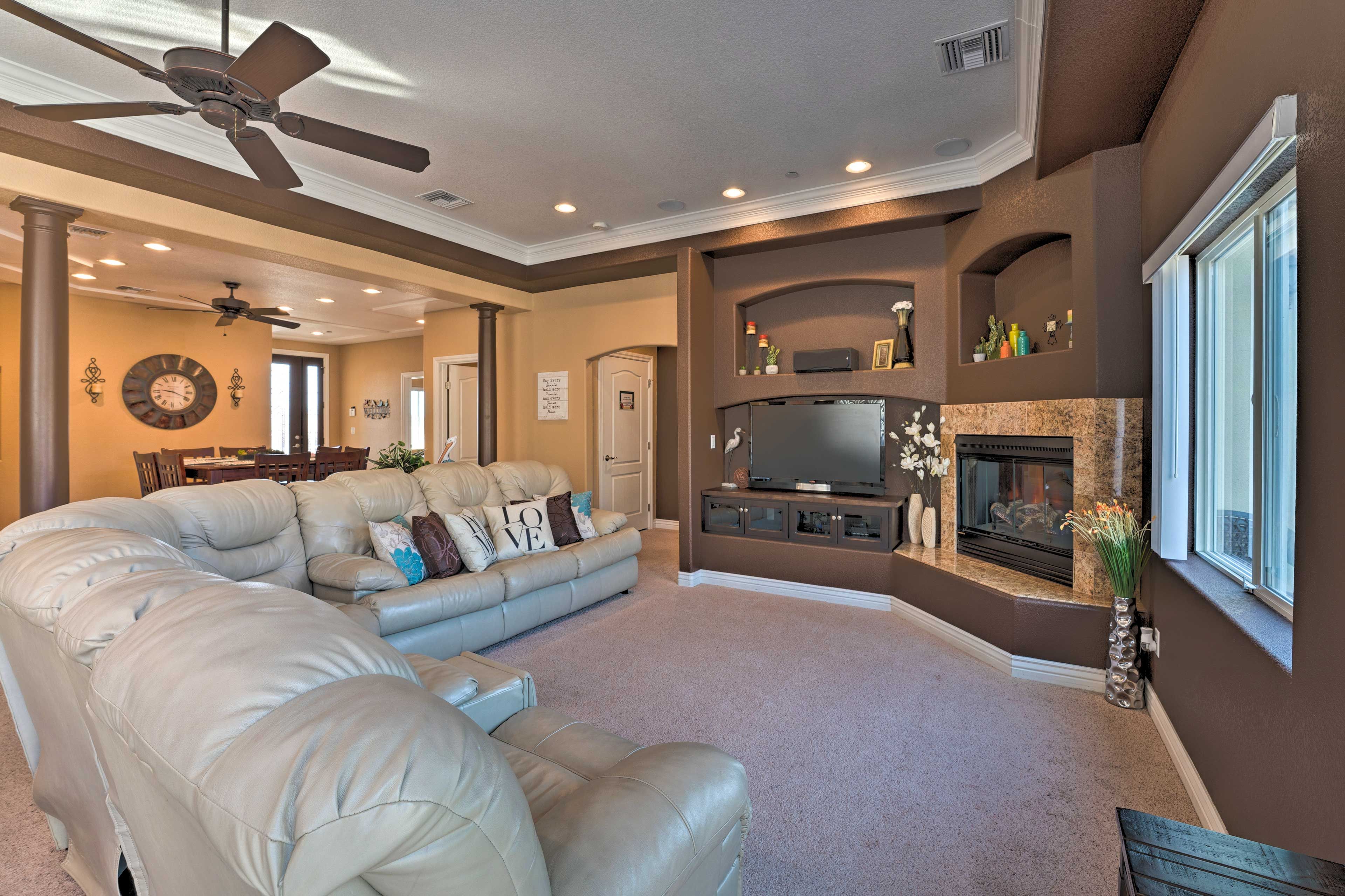 Living Room | Gas Fireplace | Private Balcony Access | Ceiling Fan
