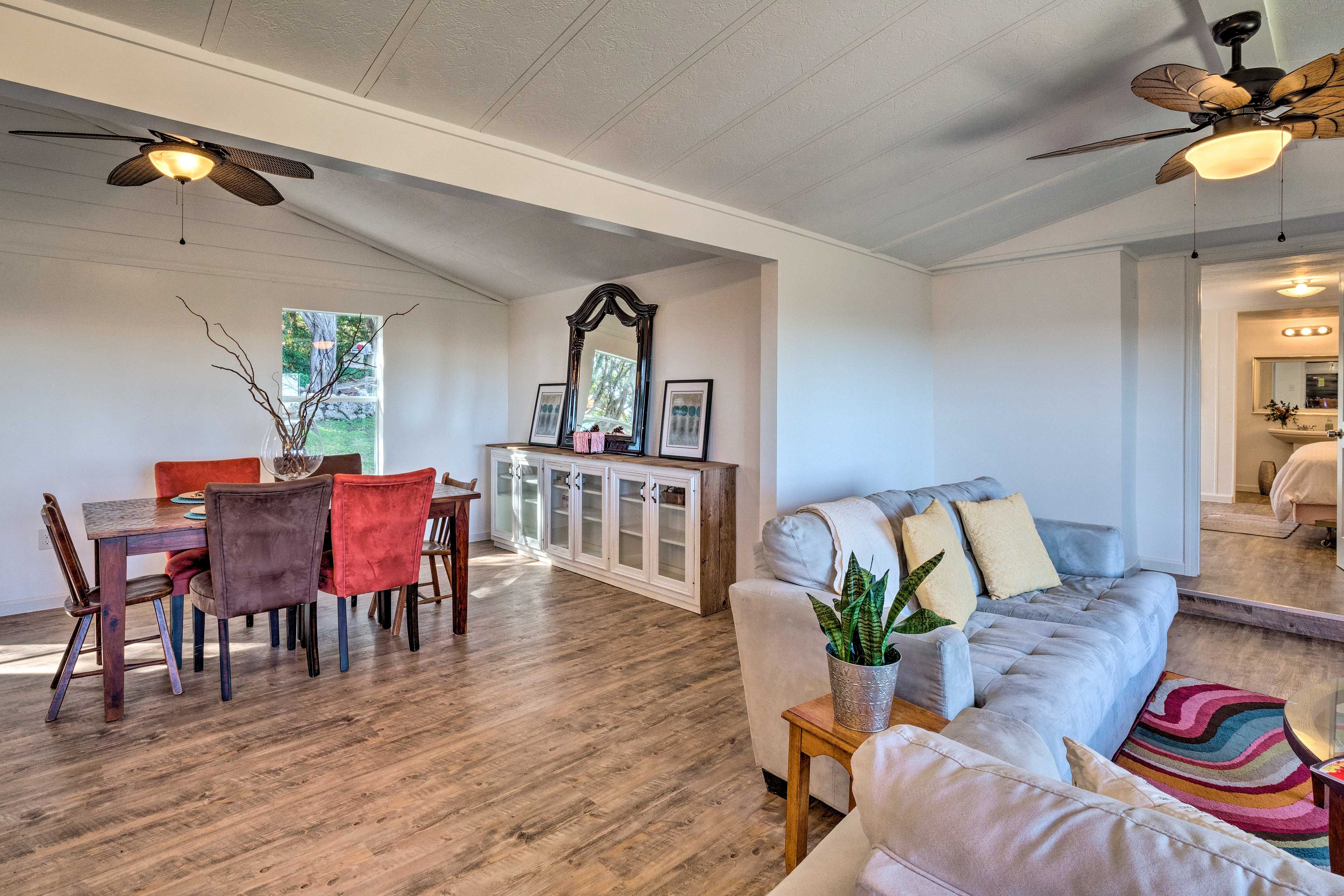 The open living area leads into the chic dining area.