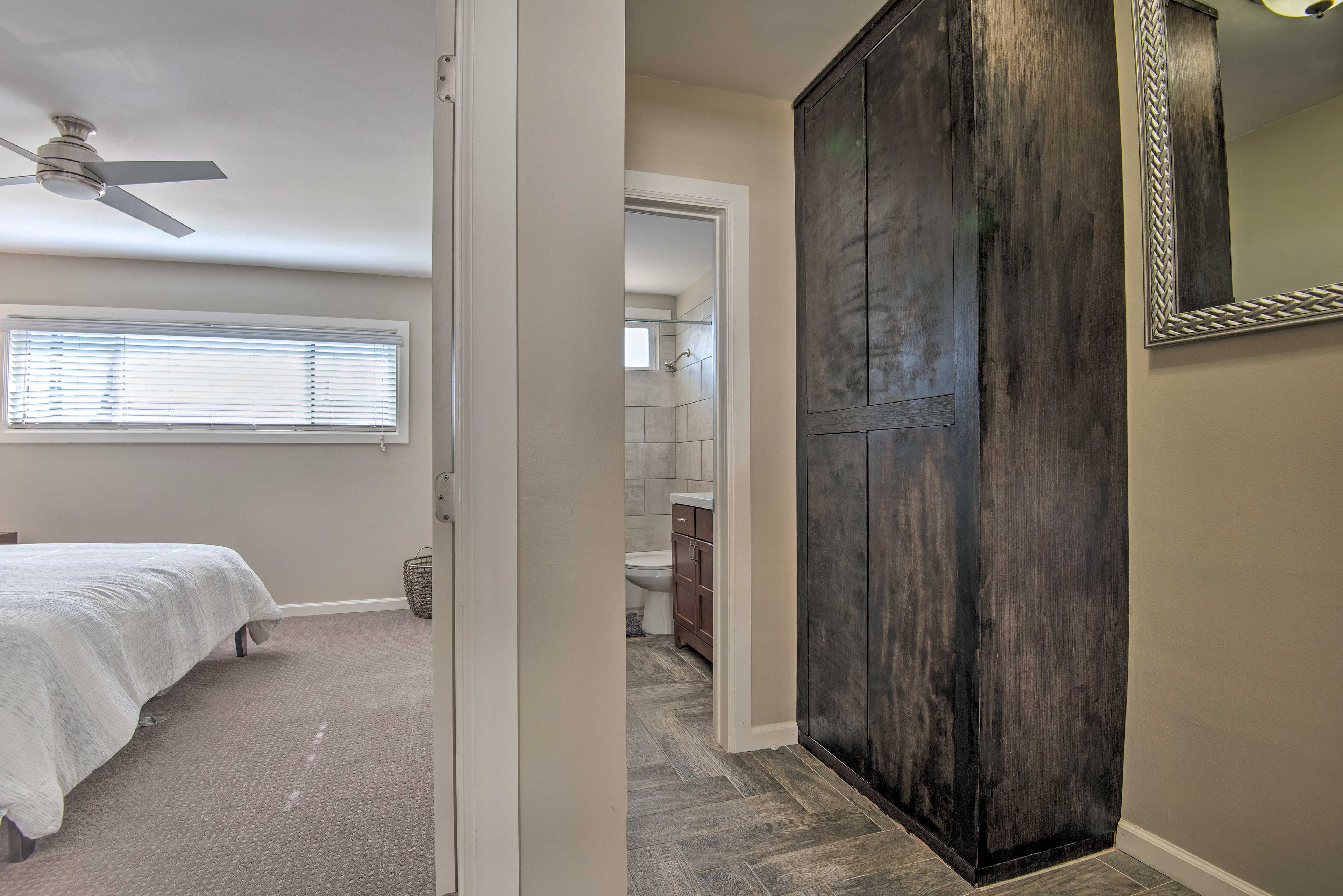 This bedroom has both a walk in closet and en suite bathroom.