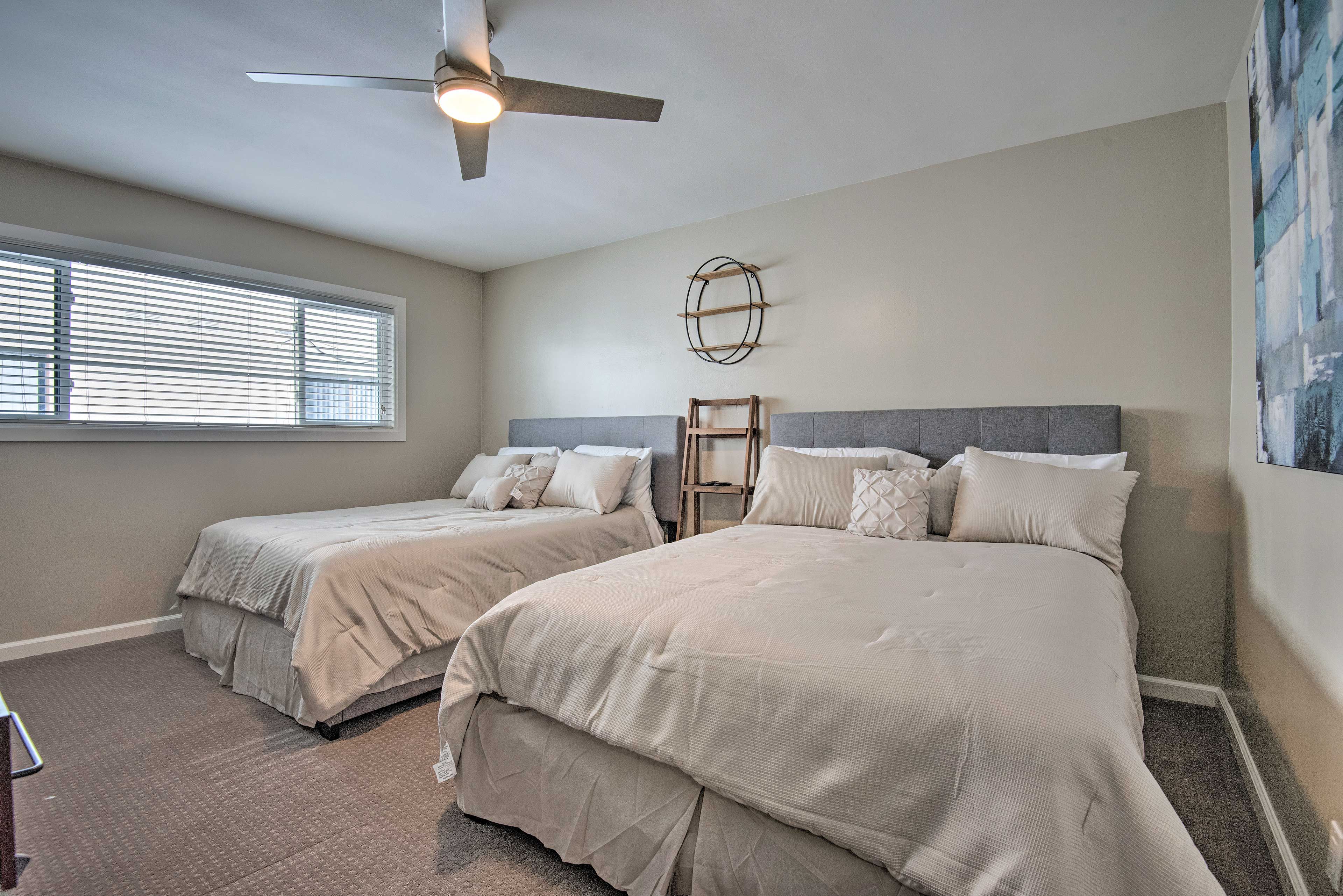 This second bedroom is home to 2 queen beds.