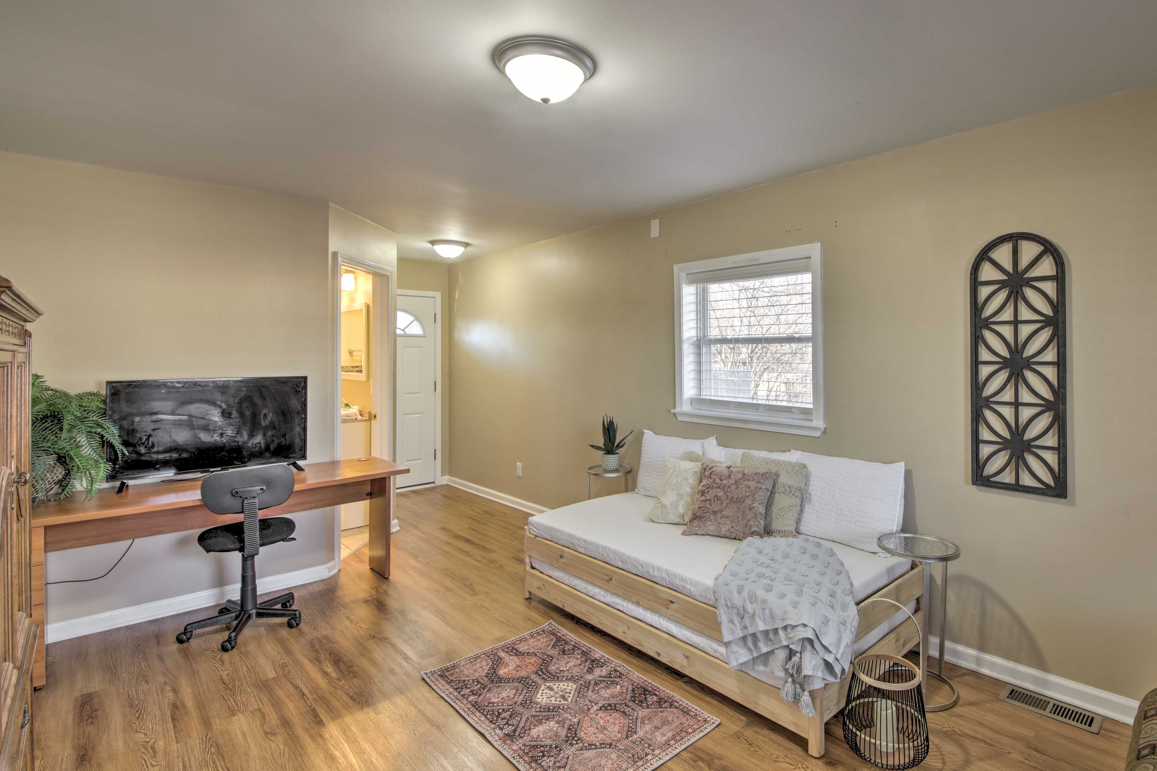 Four guests can sleep in this room with a futon and 2 twin beds.