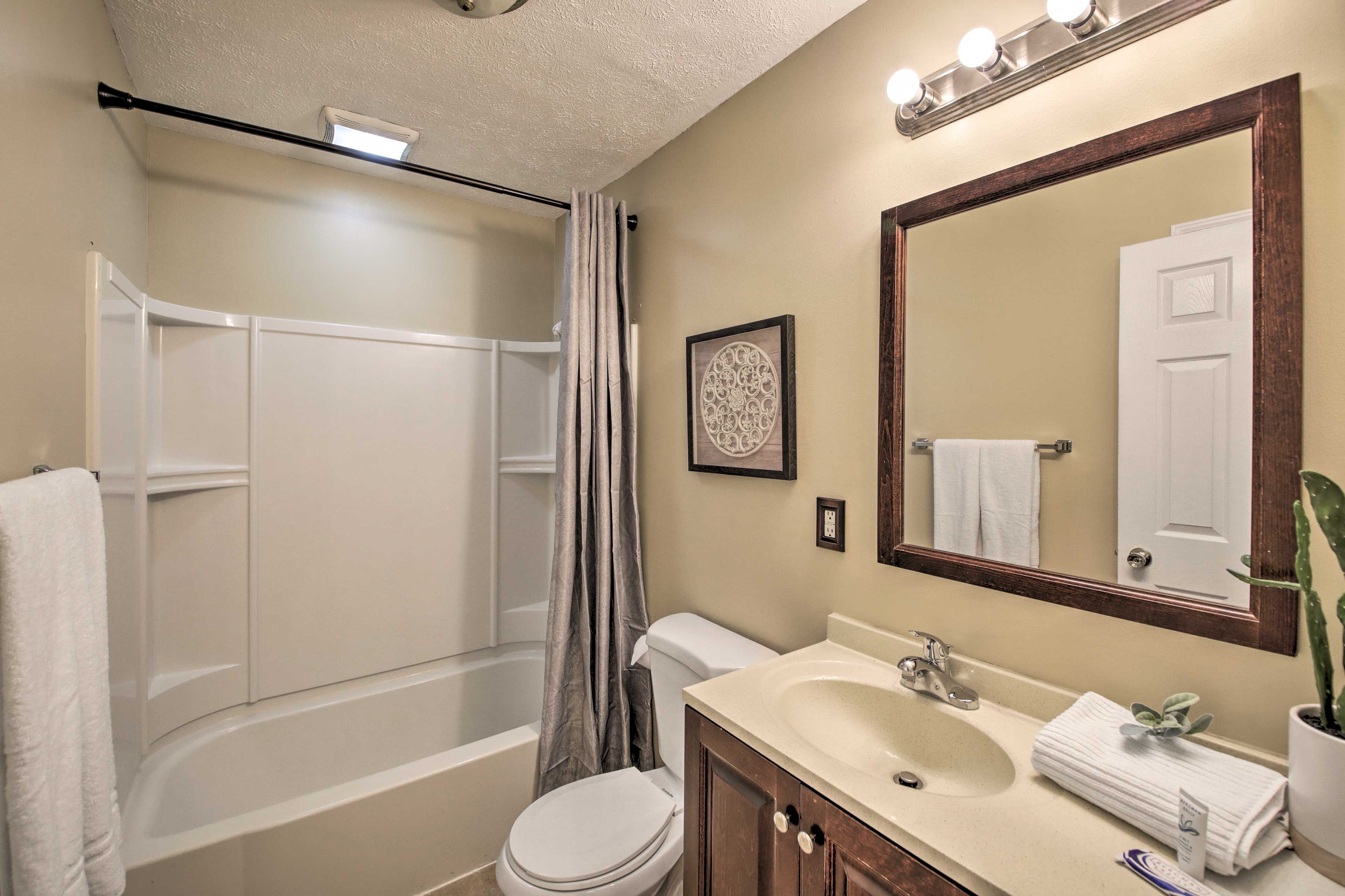 The second bathroom hosts a shower/tub combo.