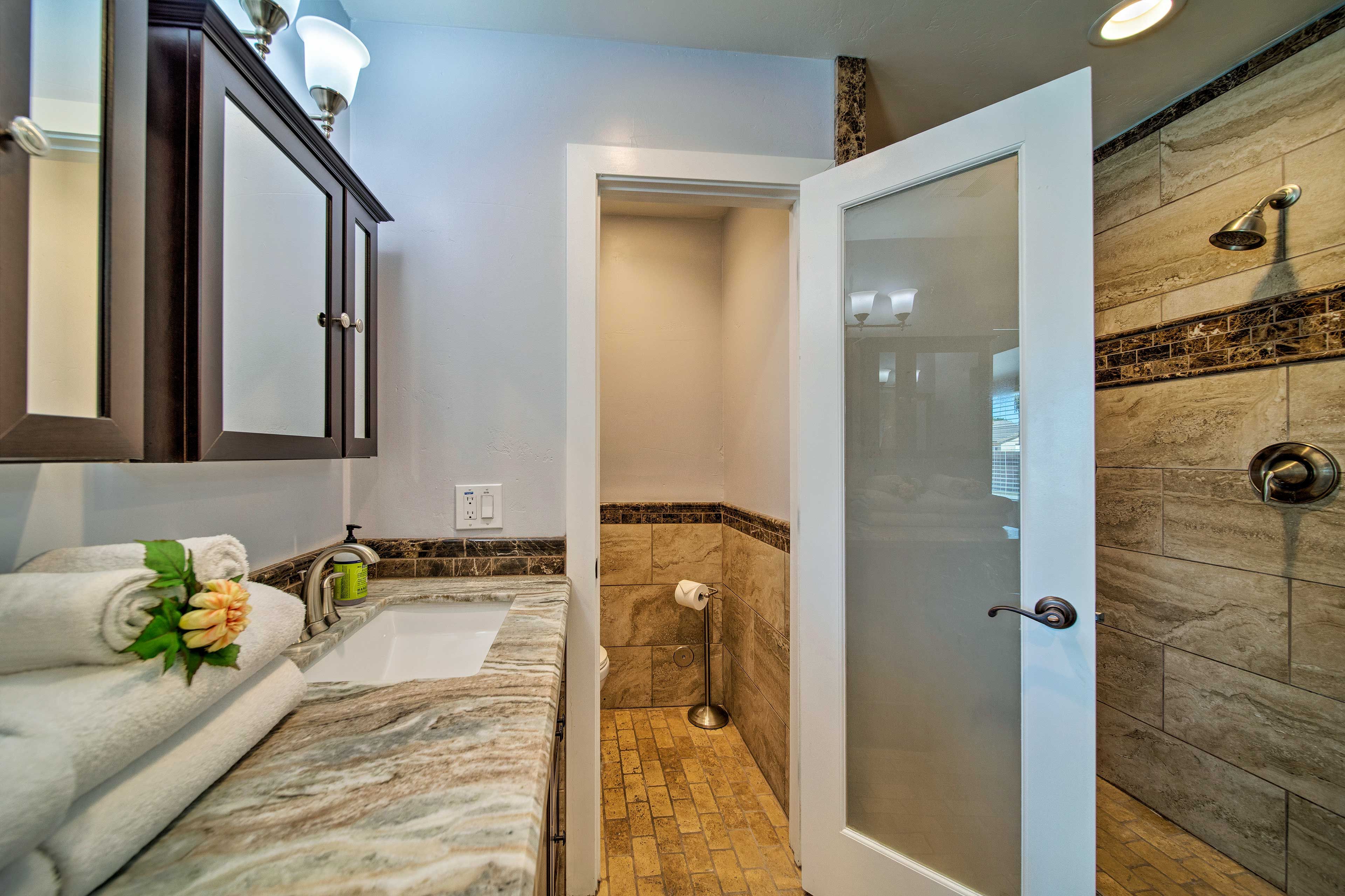 Rinse off in the walk-in shower in the en-suite bathroom.