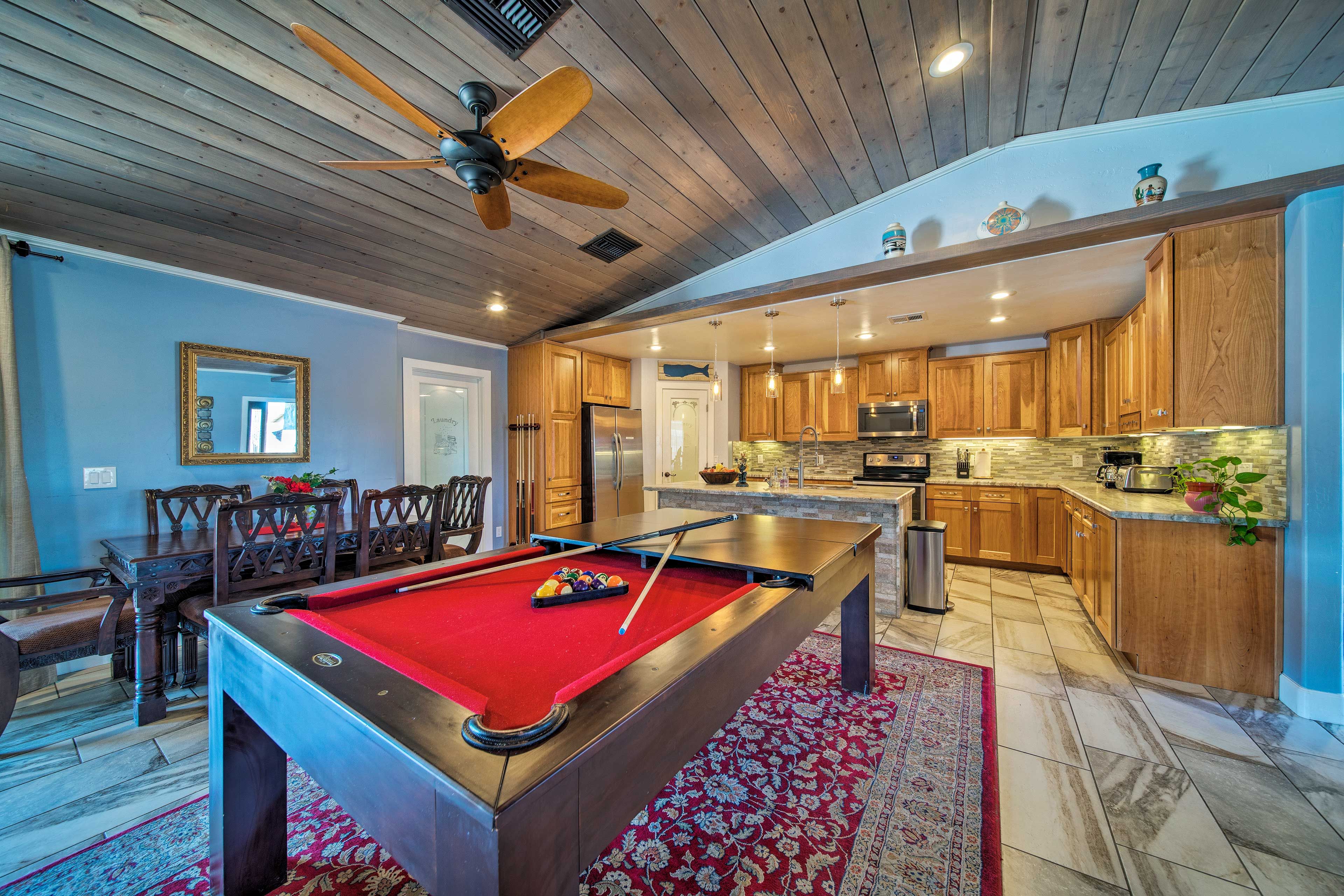 Play a game of pool on the full-sized billiards table.