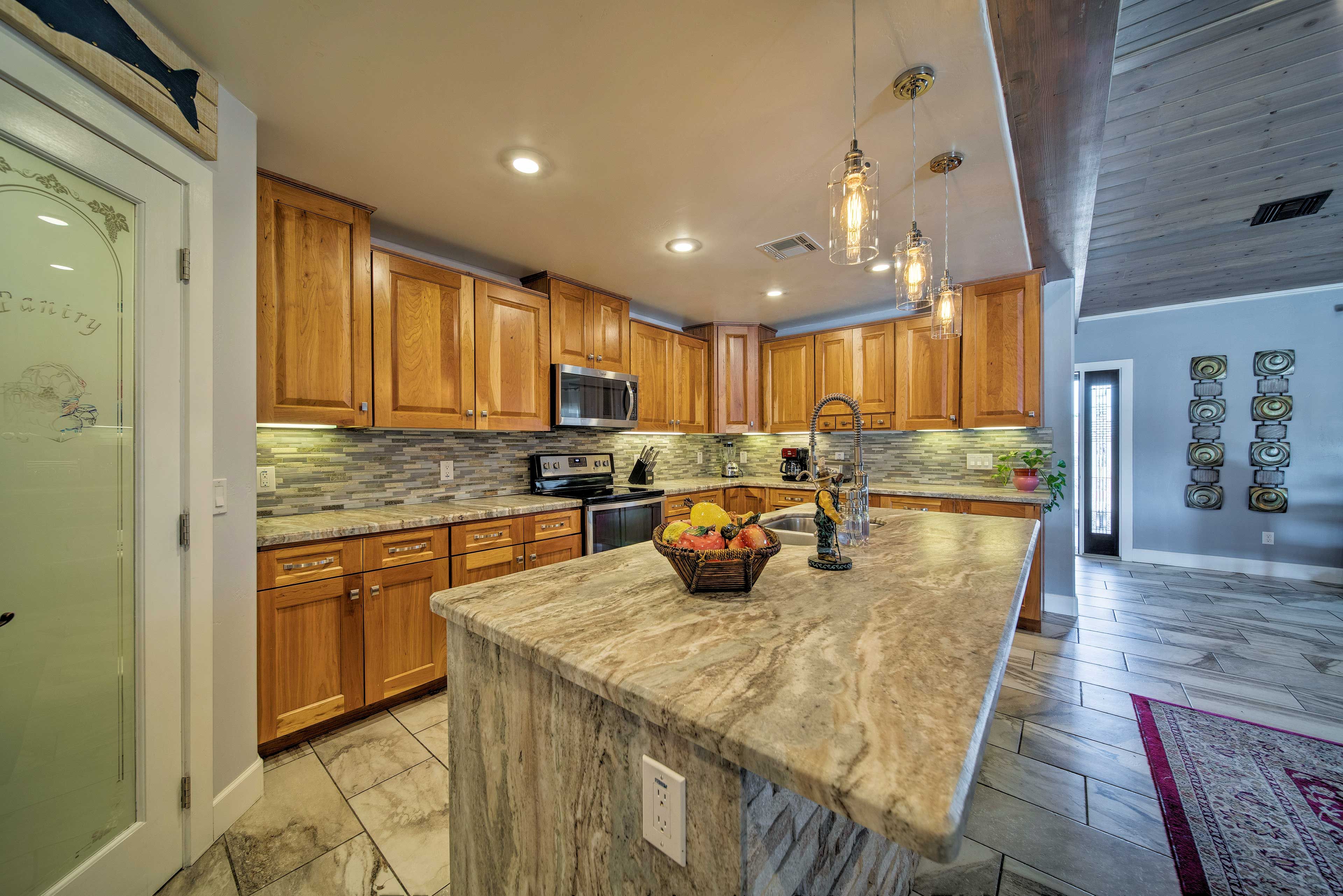 Granite countertops and stainless steel appliances elevate this kitchen.