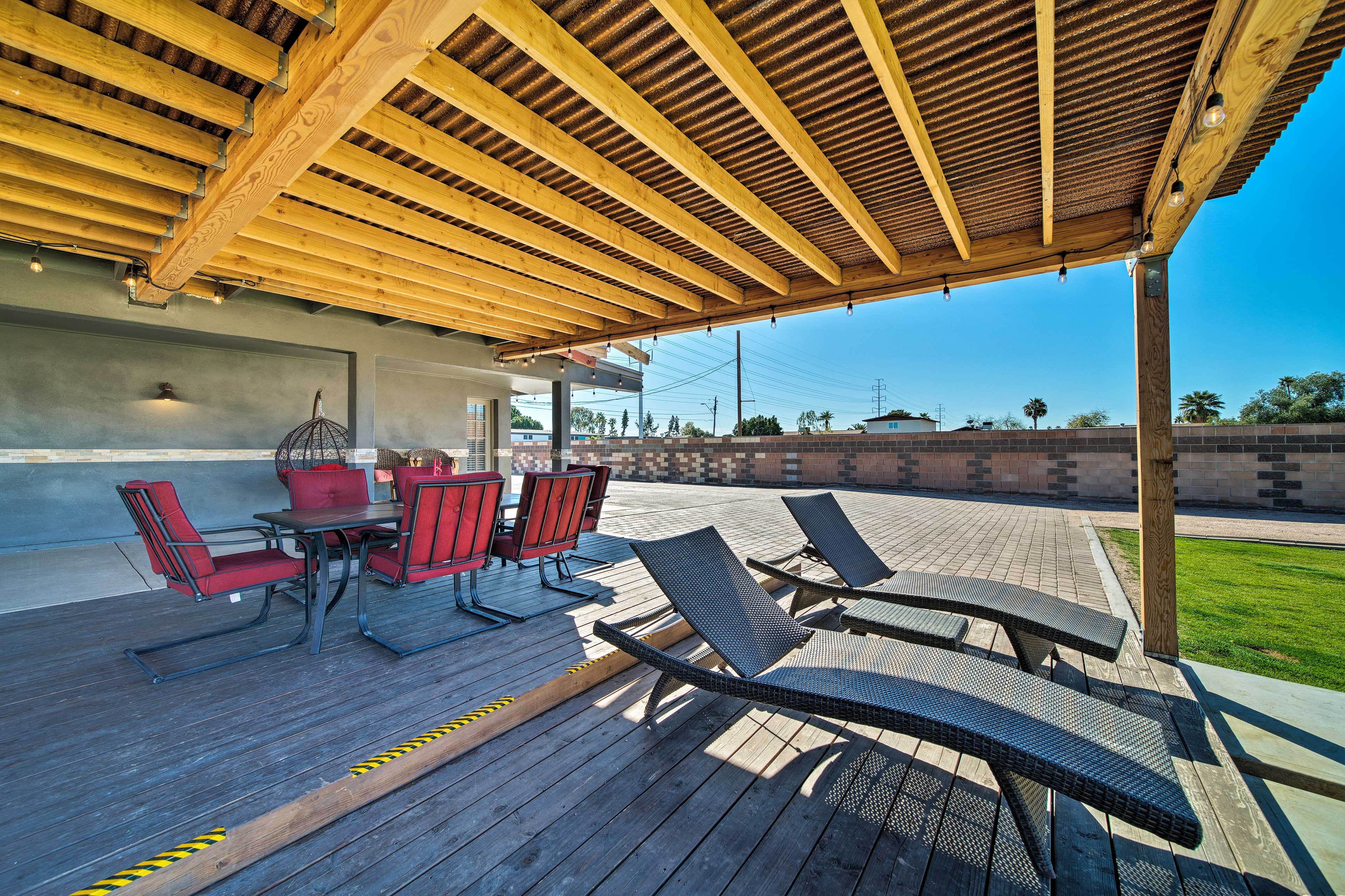 Enjoy the Arizona weather on the lounge chairs in the backyard.