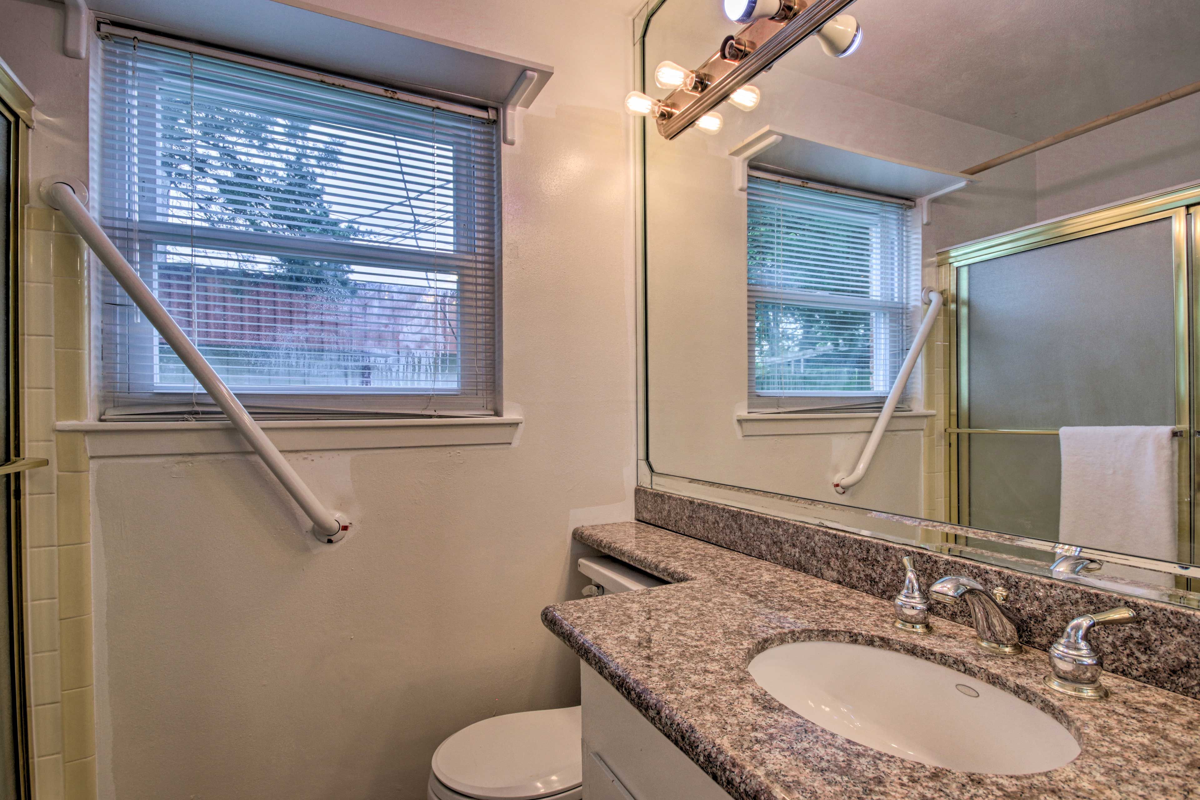 The en-suite bathroom has a handrail for ease of access.