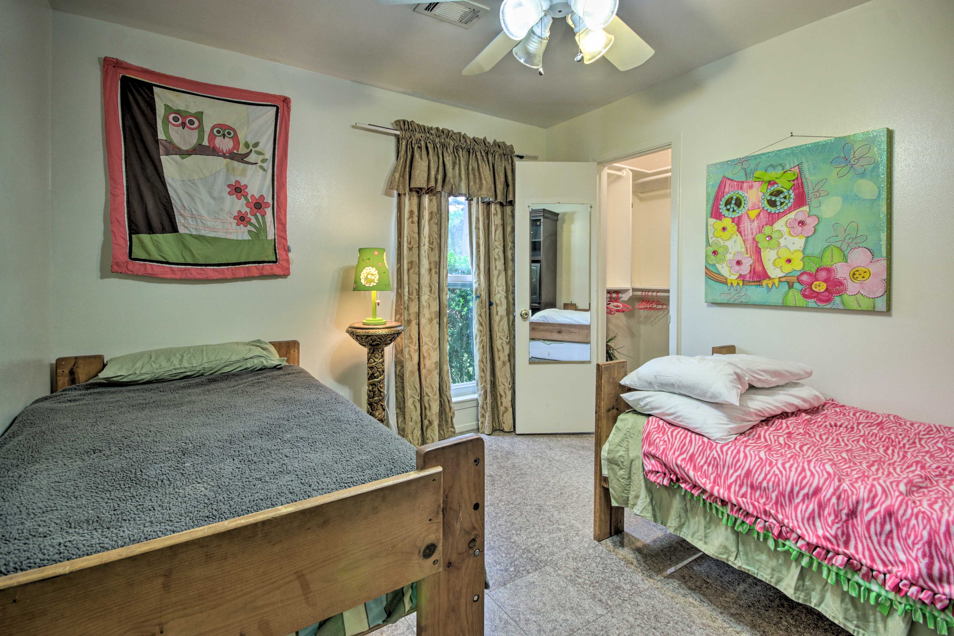 Kids will feel at home in the third bedroom with owl-themed decor.