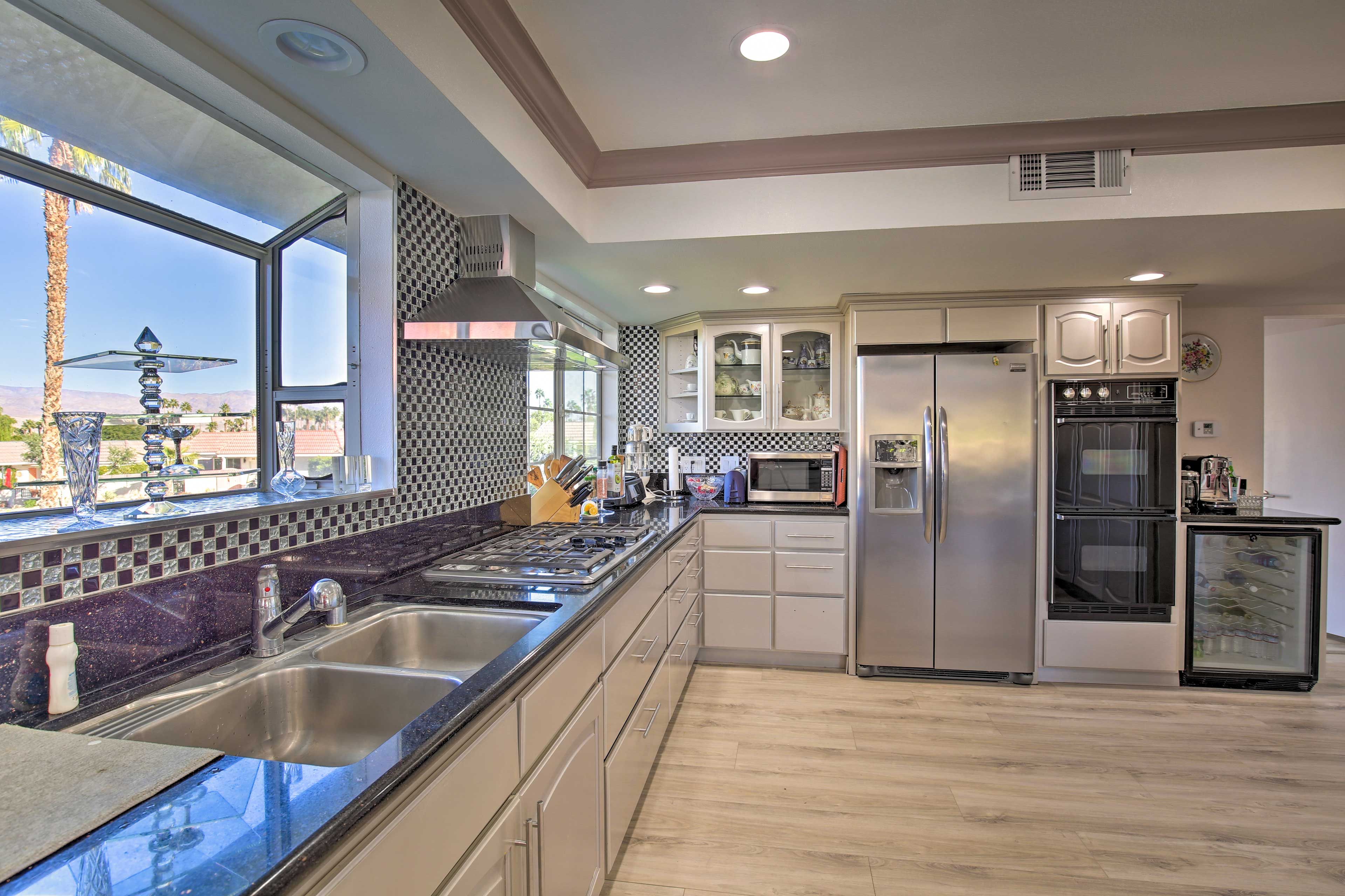 This kitchen features all of the bells and whistles needed for cooking and more.