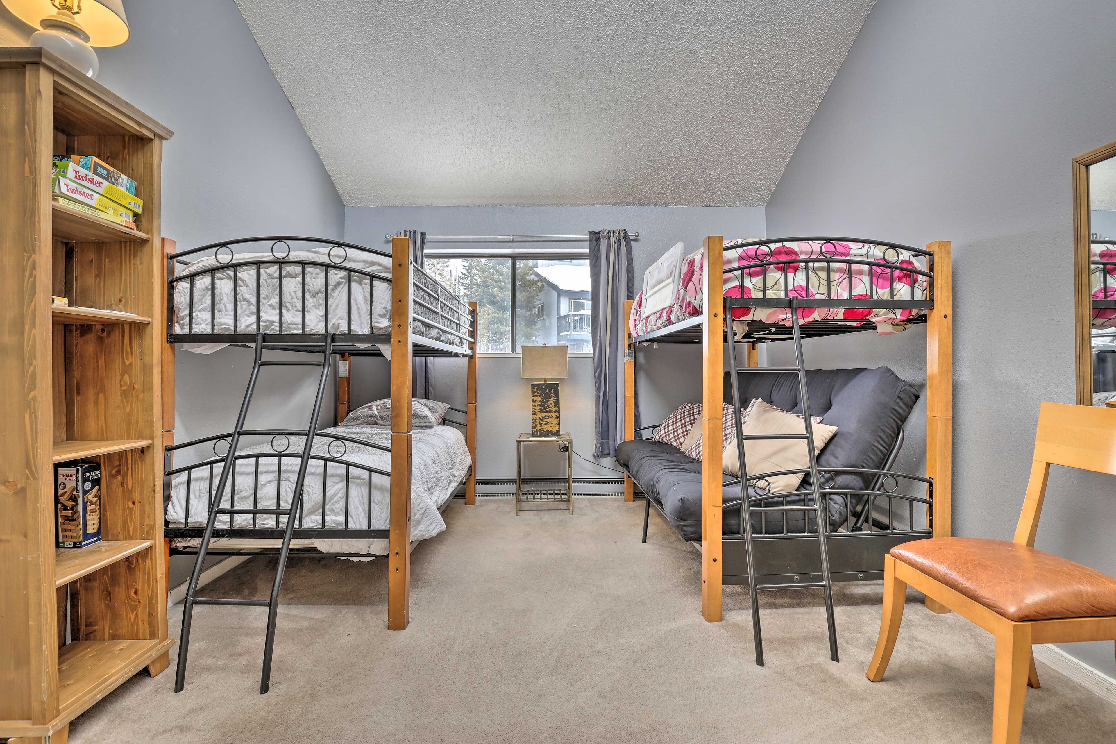 Bedroom 2 features 3 twin beds and 1 full futon bed.