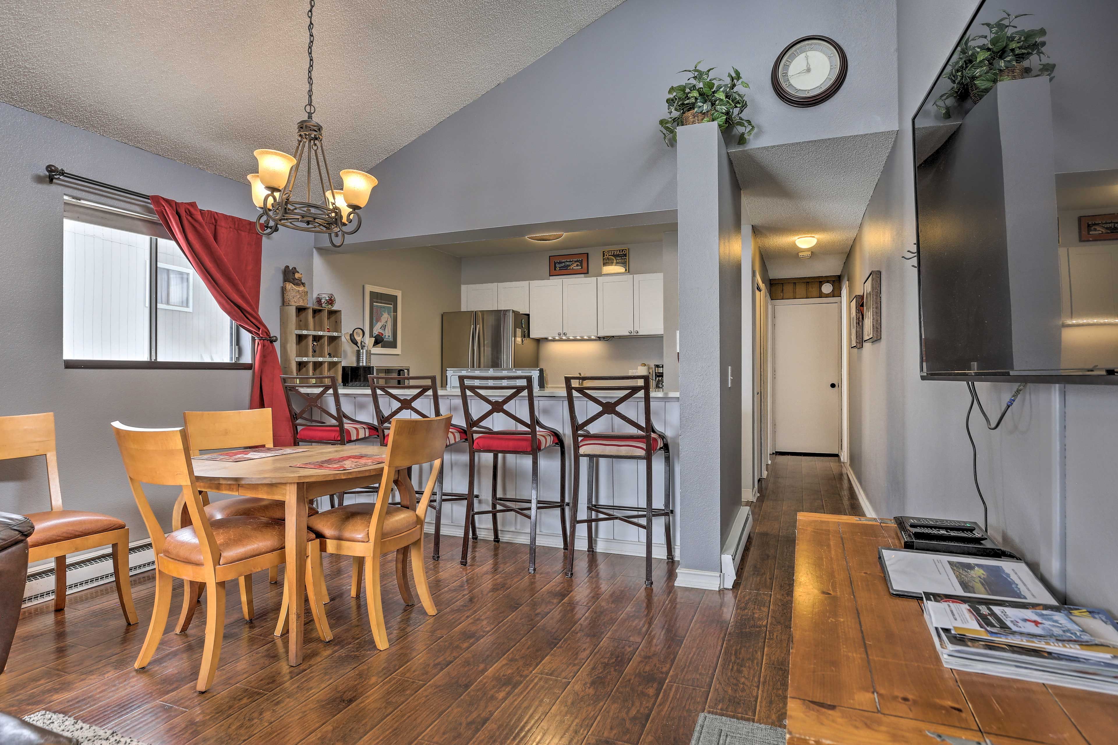 Keep the person cooking company by hanging out at the breakfast bar.