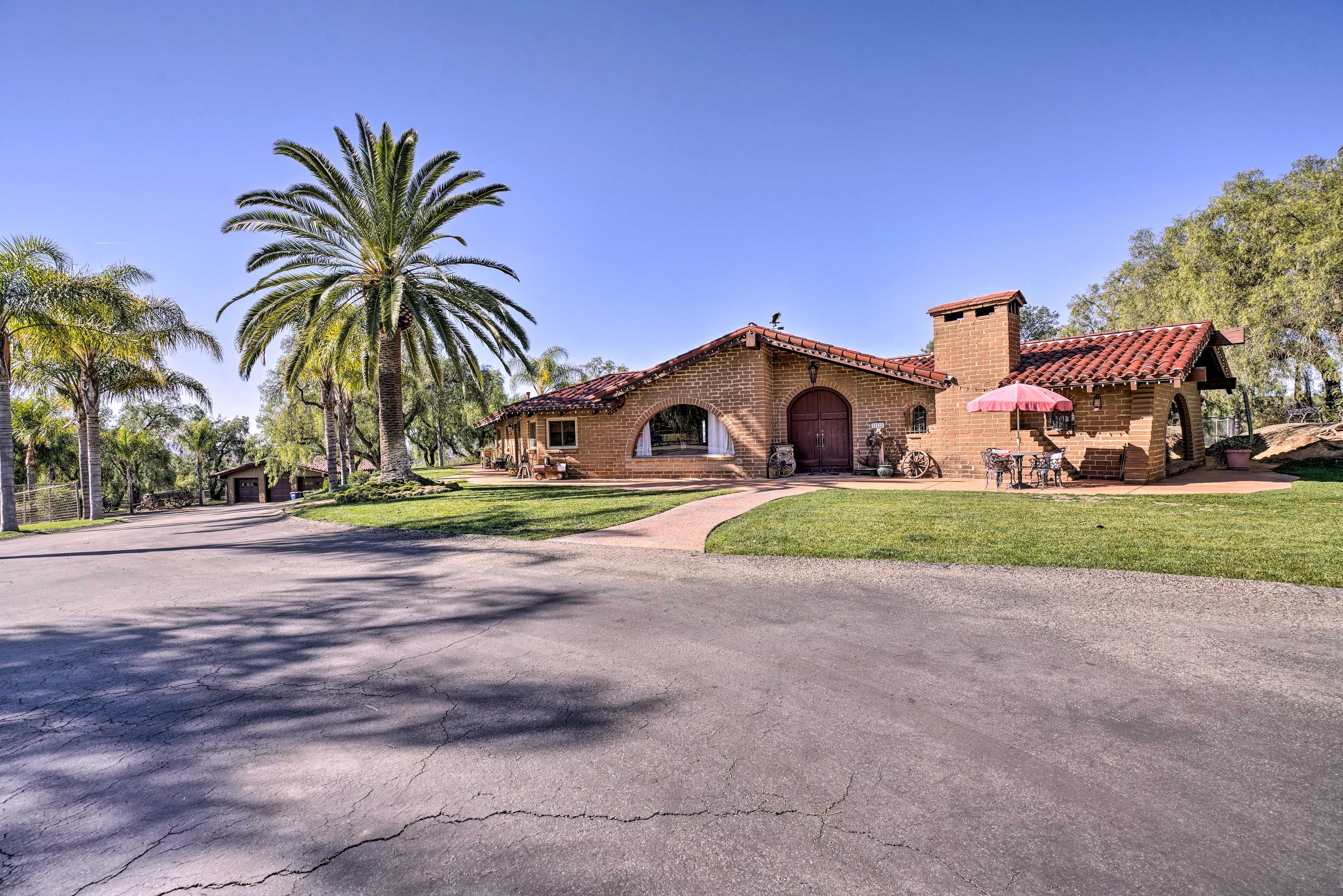 Just past the estate, discover unique adobe horse stables.