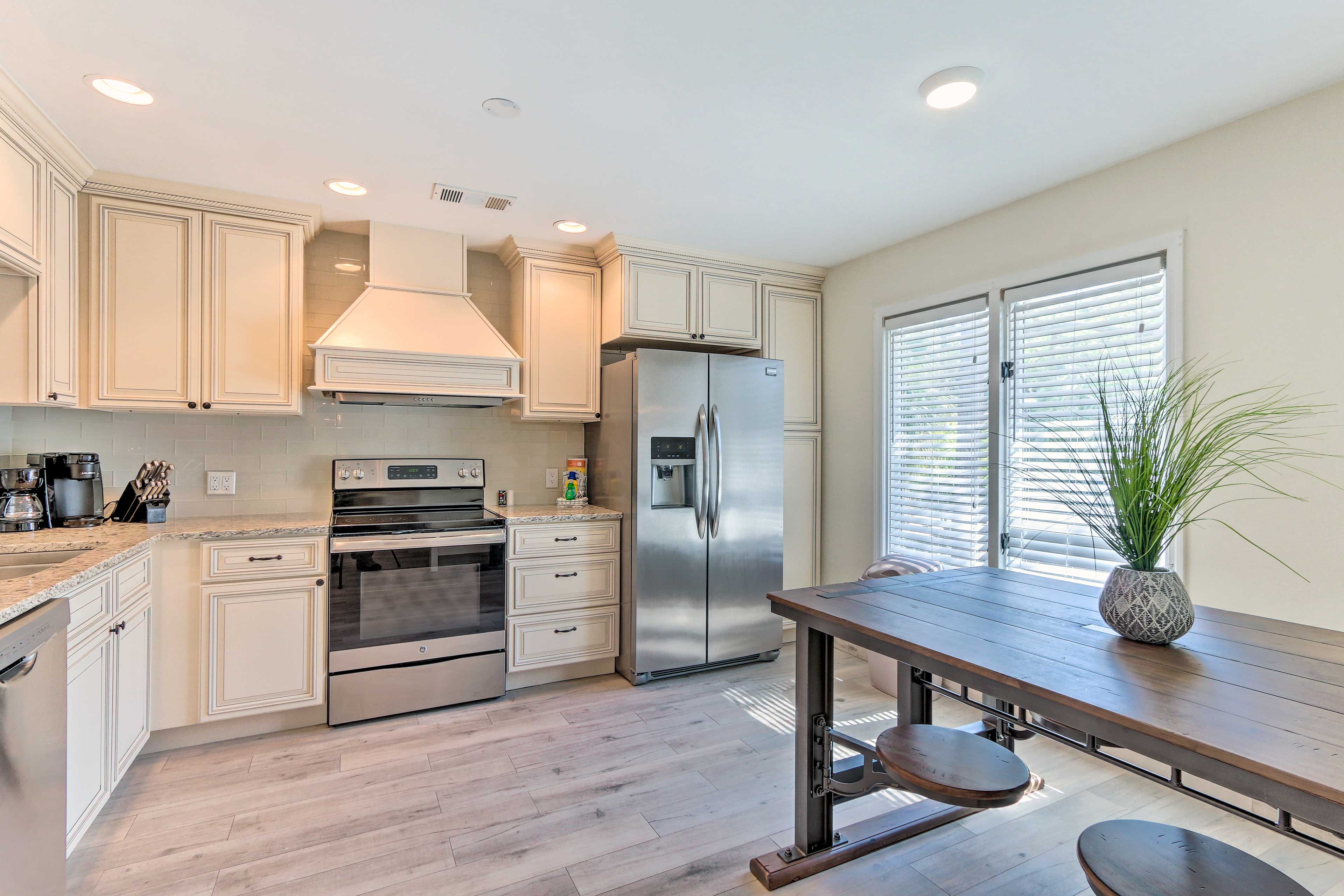 Stainless steel appliances highlight the fully equipped kitchen.