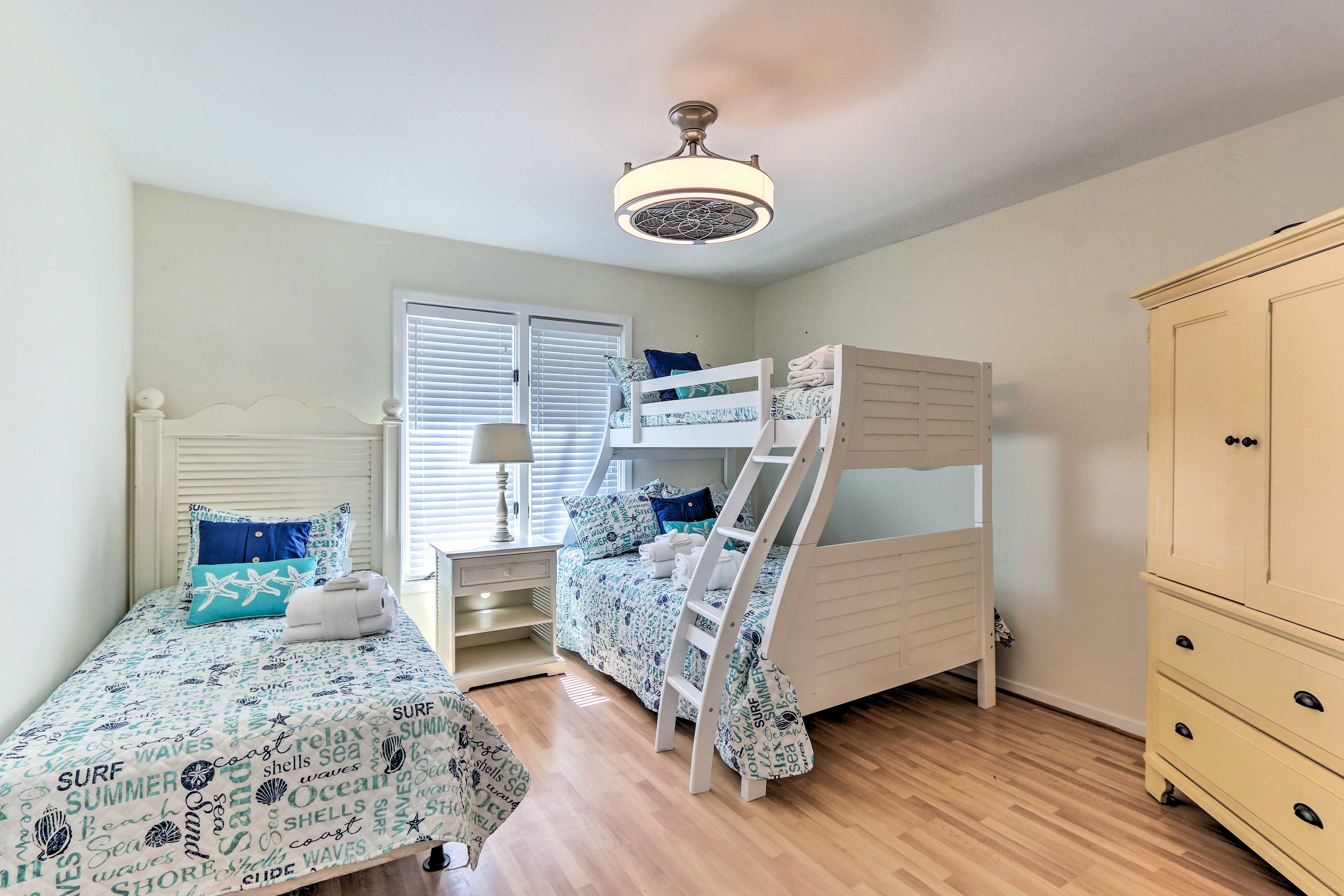 The third bedroom hosts a twin bed and a twn/full bunk bed.