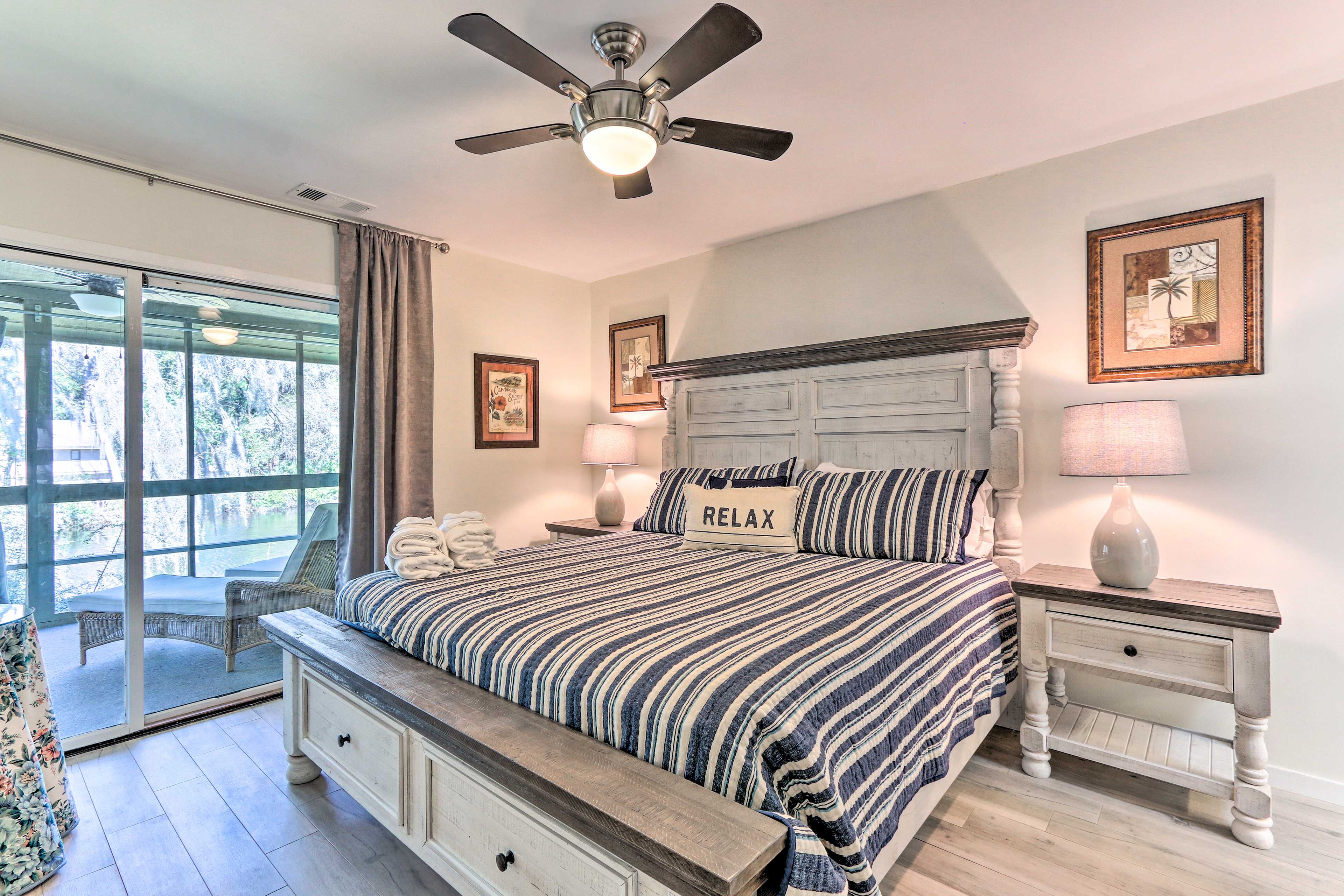 The first bedroom features a king-sized bed and porch access.