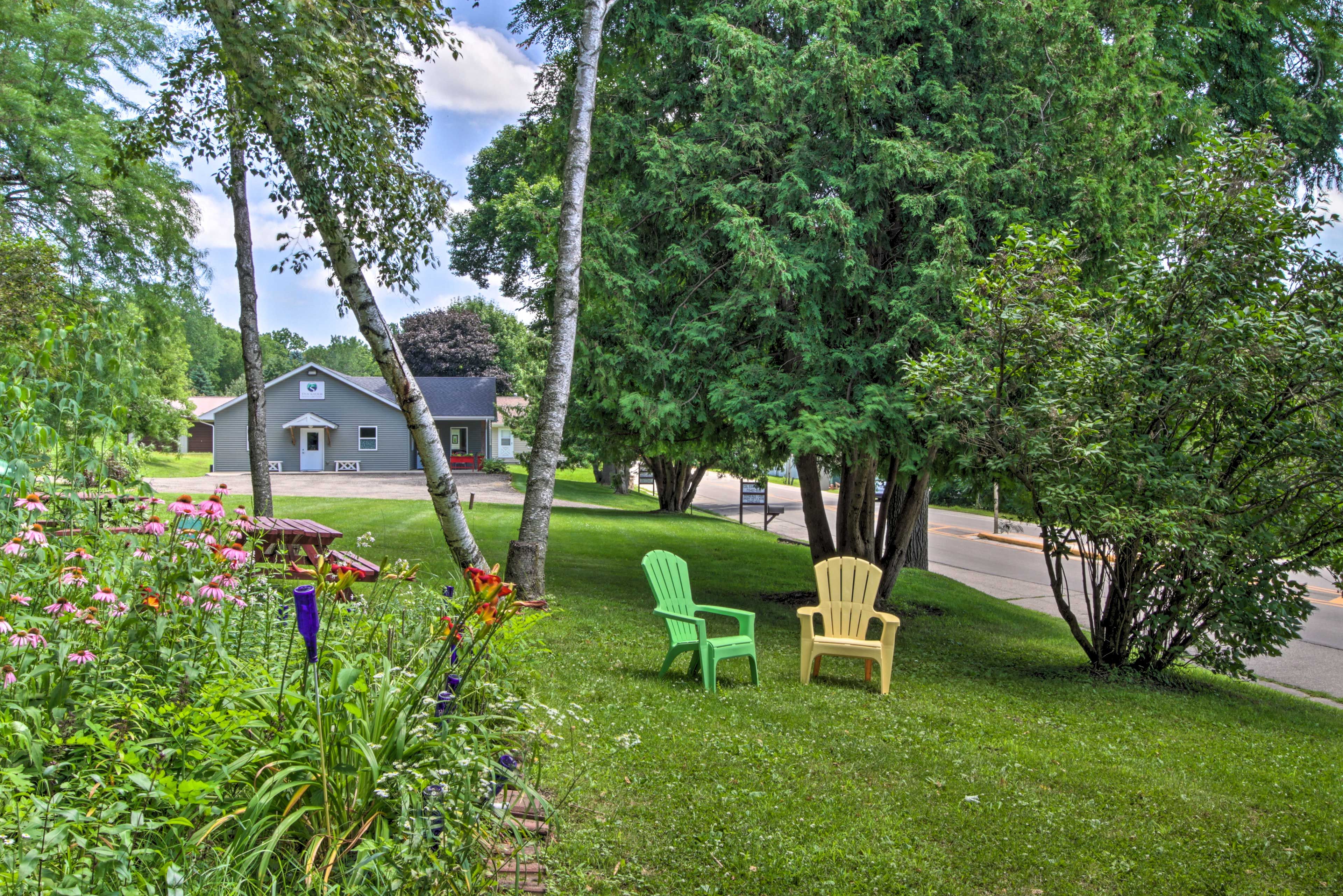 Backyard | Picnic Table | Plastic Adirondack Chairs