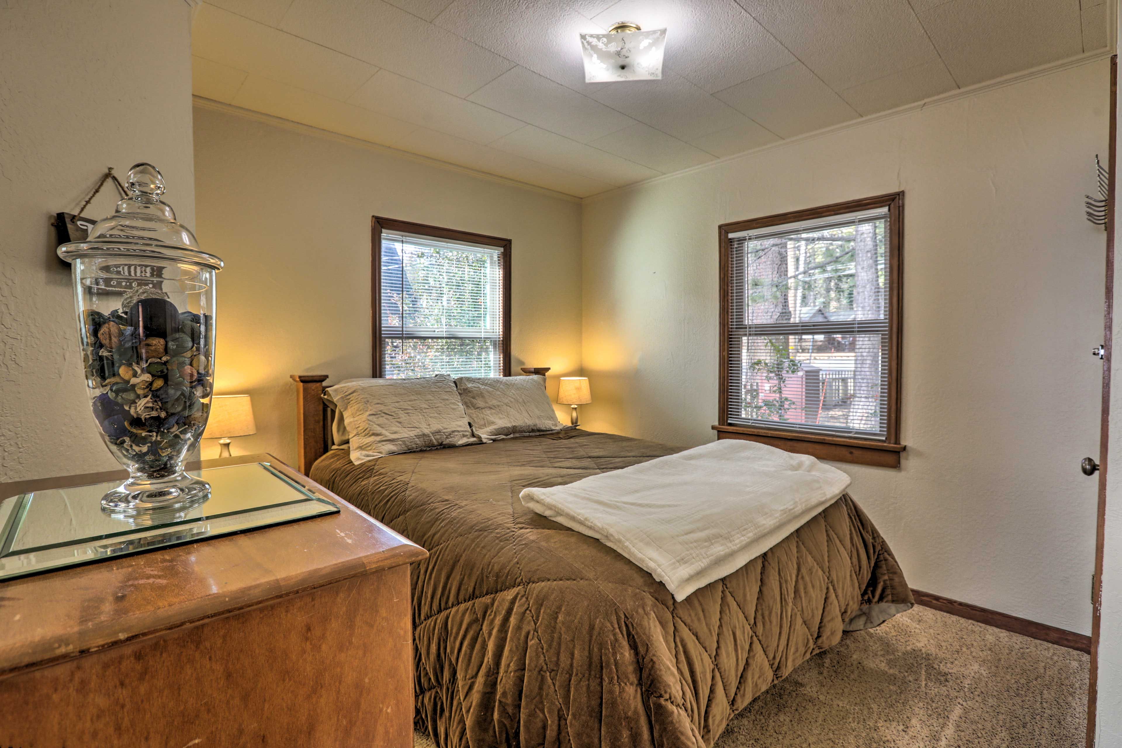 Cozy up beneath this queen beds covers for a sound night of sleep.