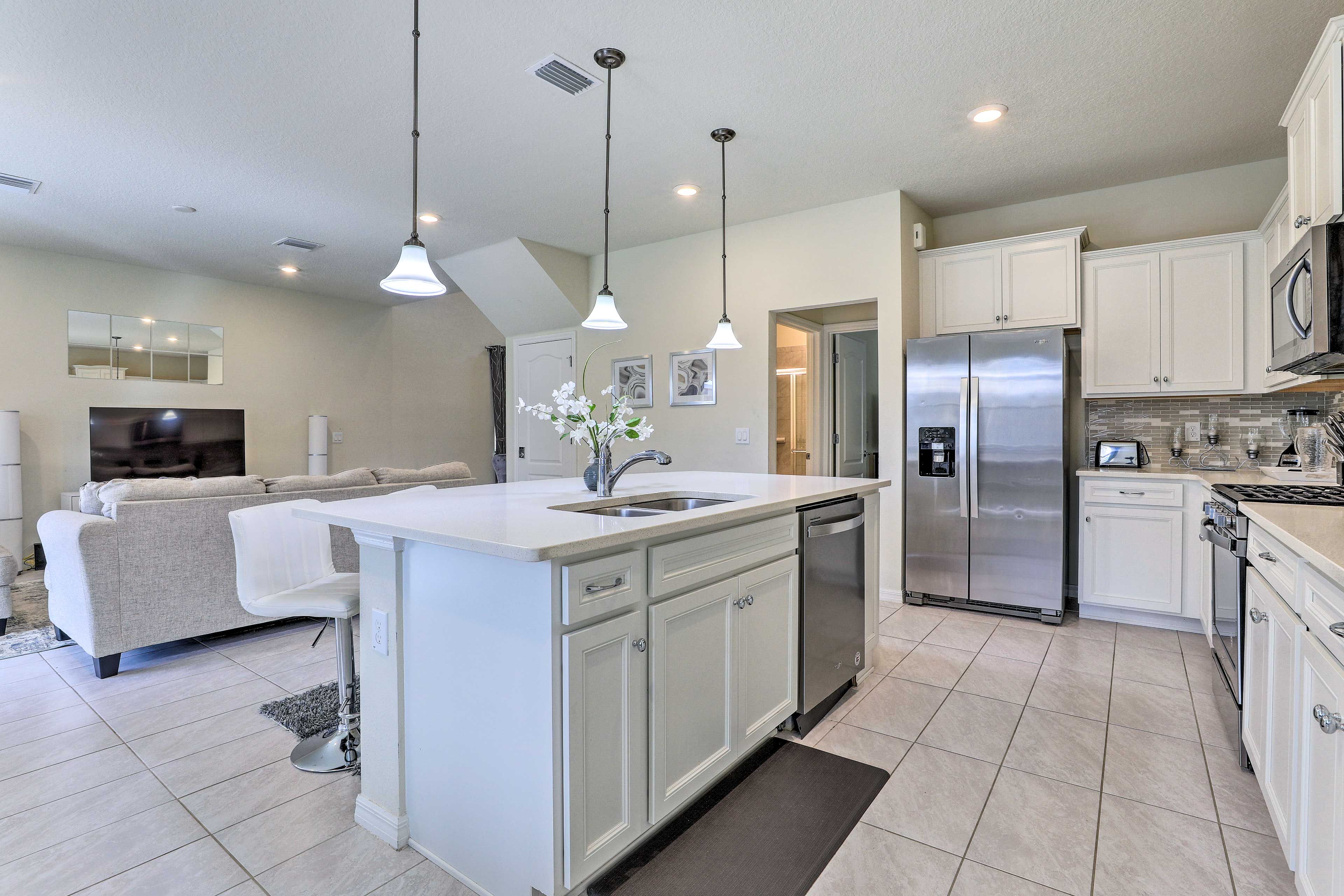 Stainless steel appliances add a modern touch to the fully equipped kitchen.