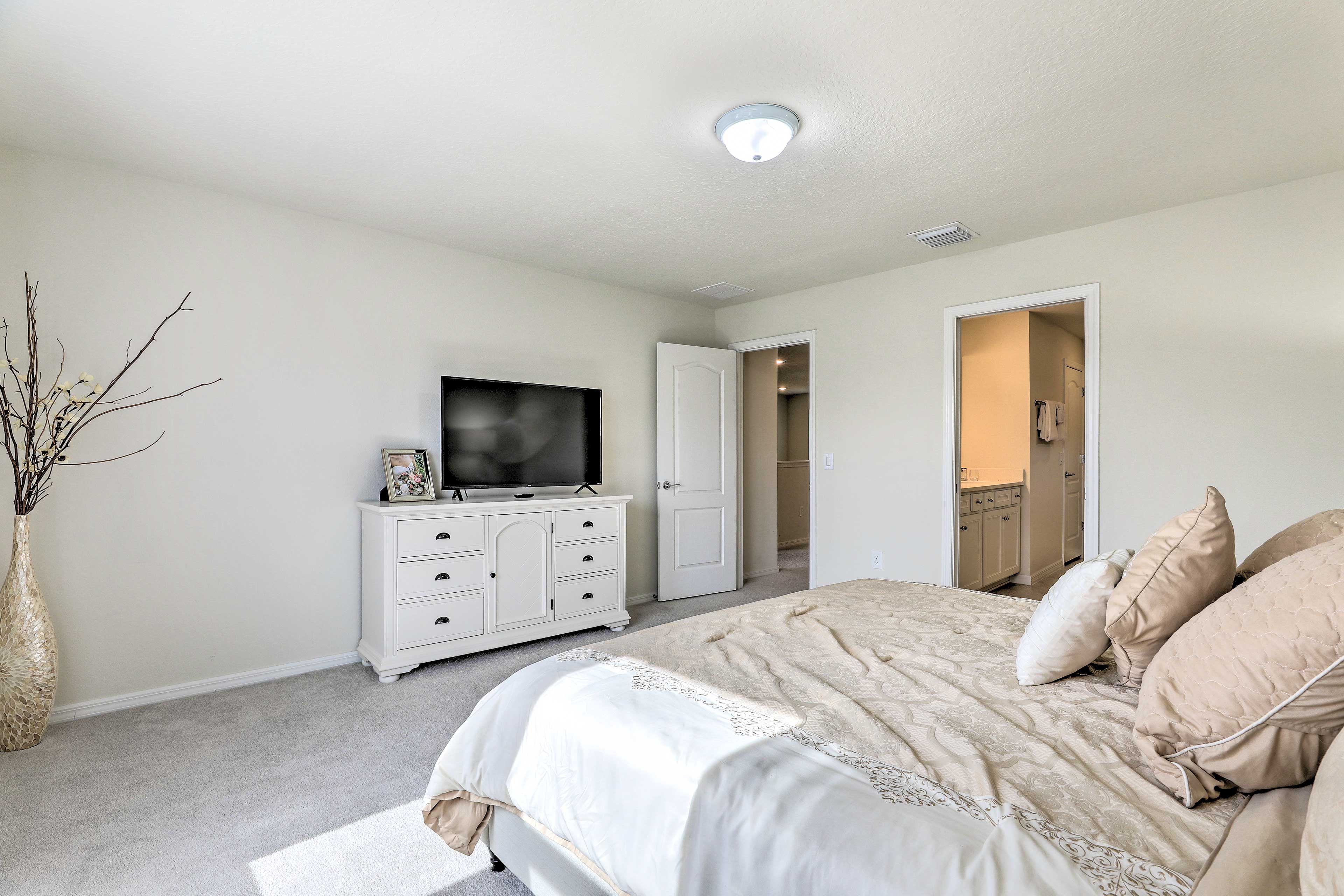 Watch your favorite flicks from the comfort of this bedroom.