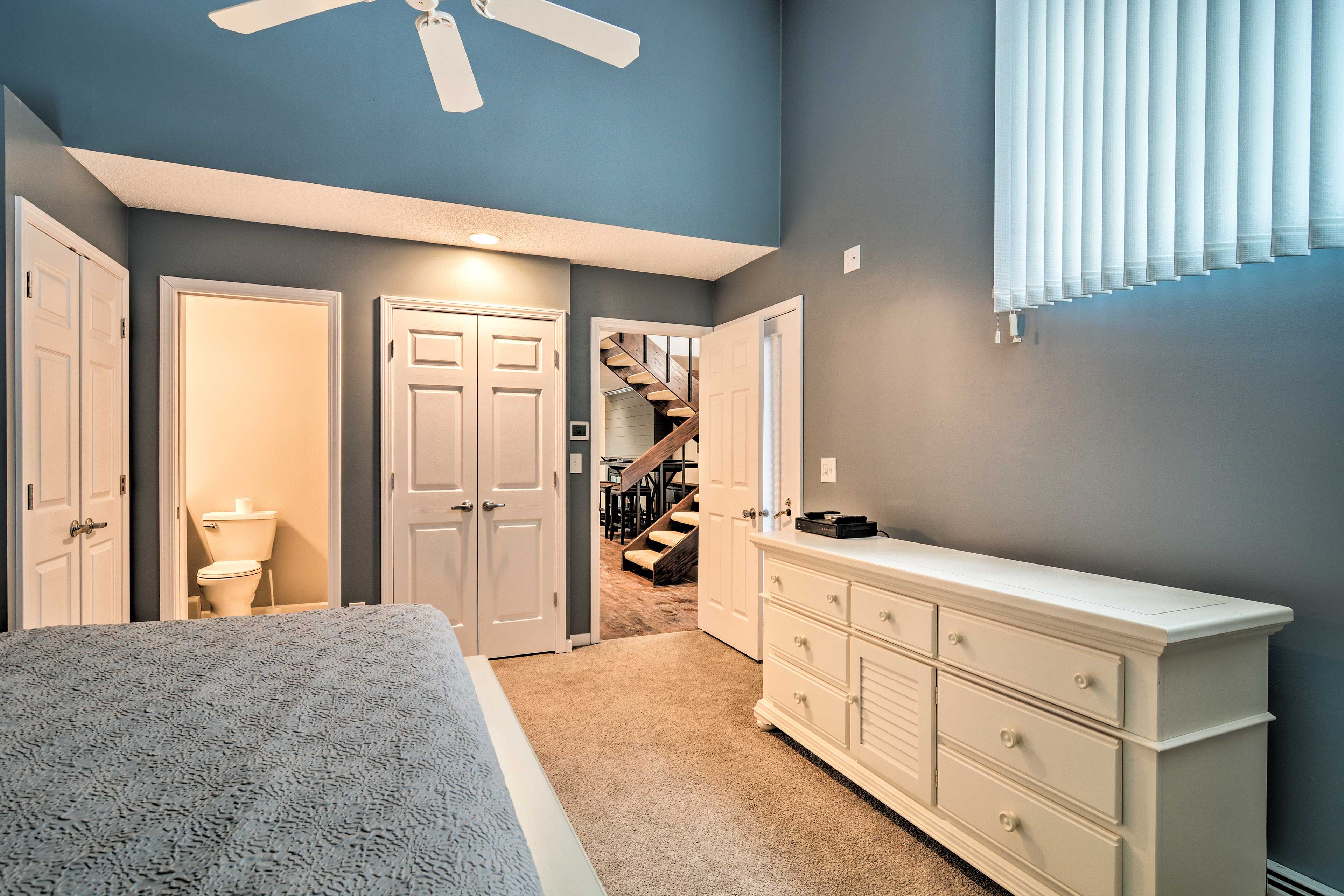 The 1st bedroom also features a spacious dresser and bathroom.