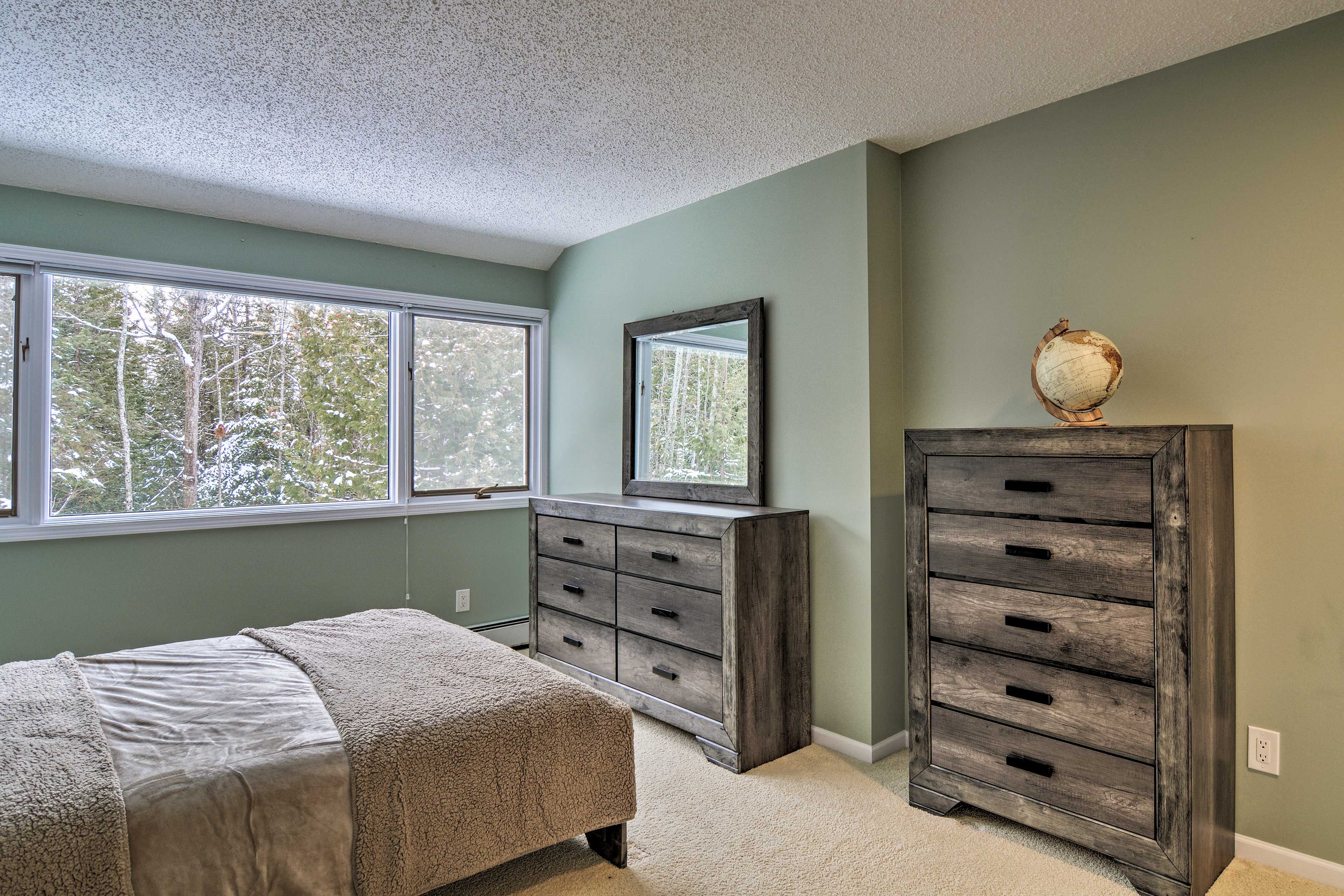 The third bedroom hosts a queen bed.