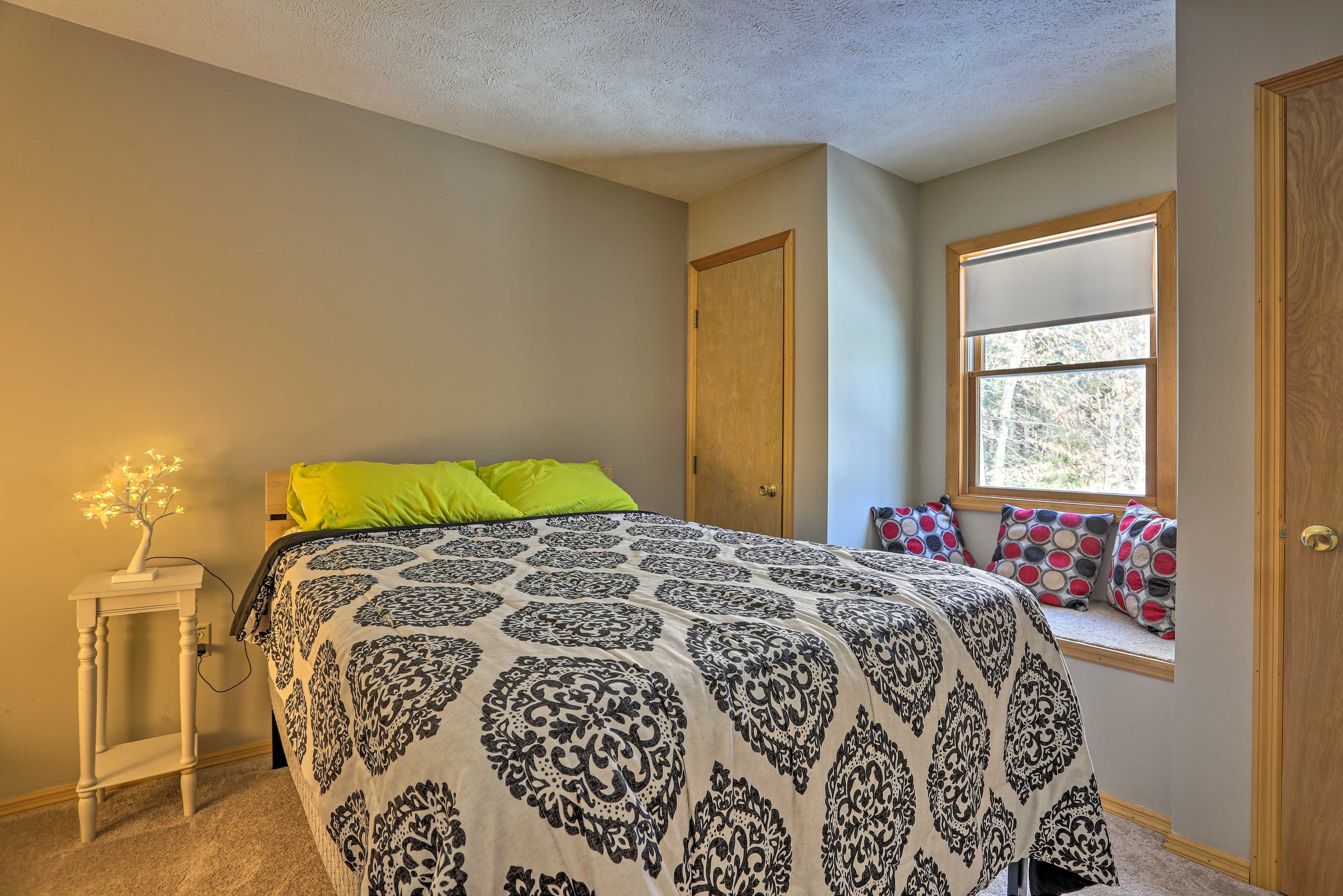 This bedroom features a full bed & bay window seat.