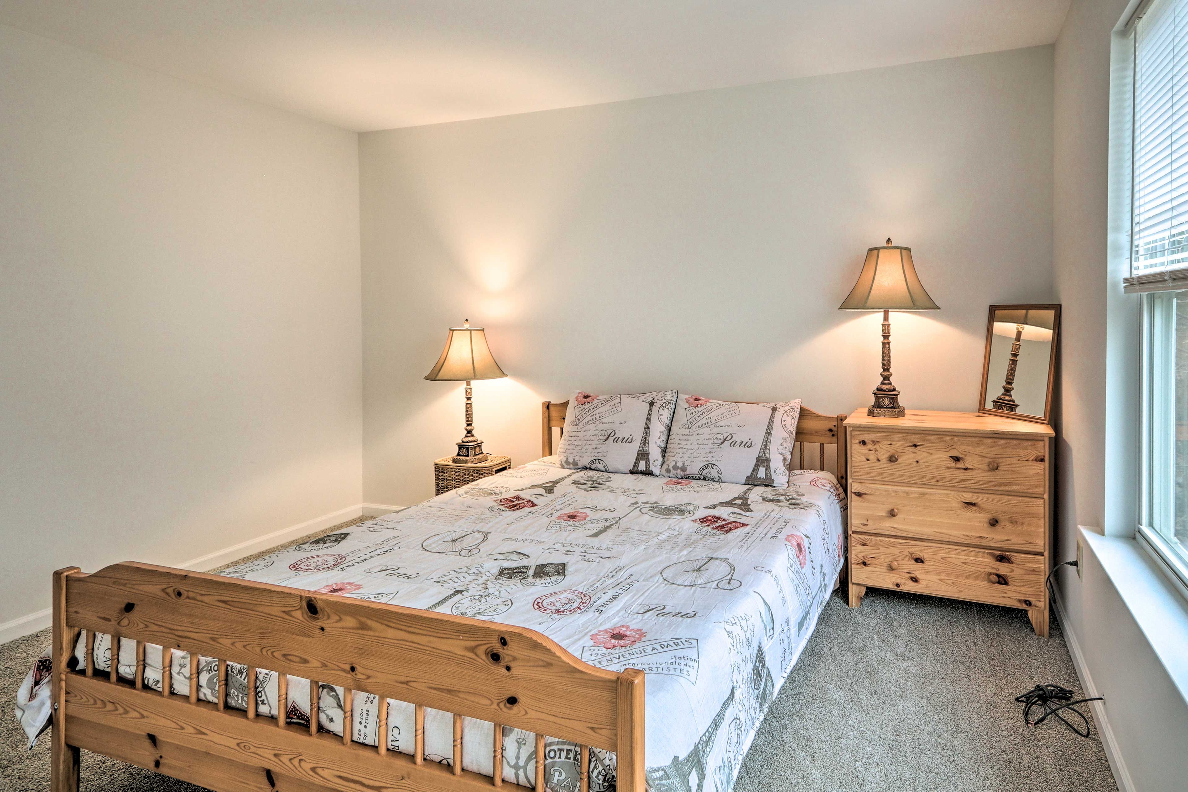 The final room features a queen bed as well.