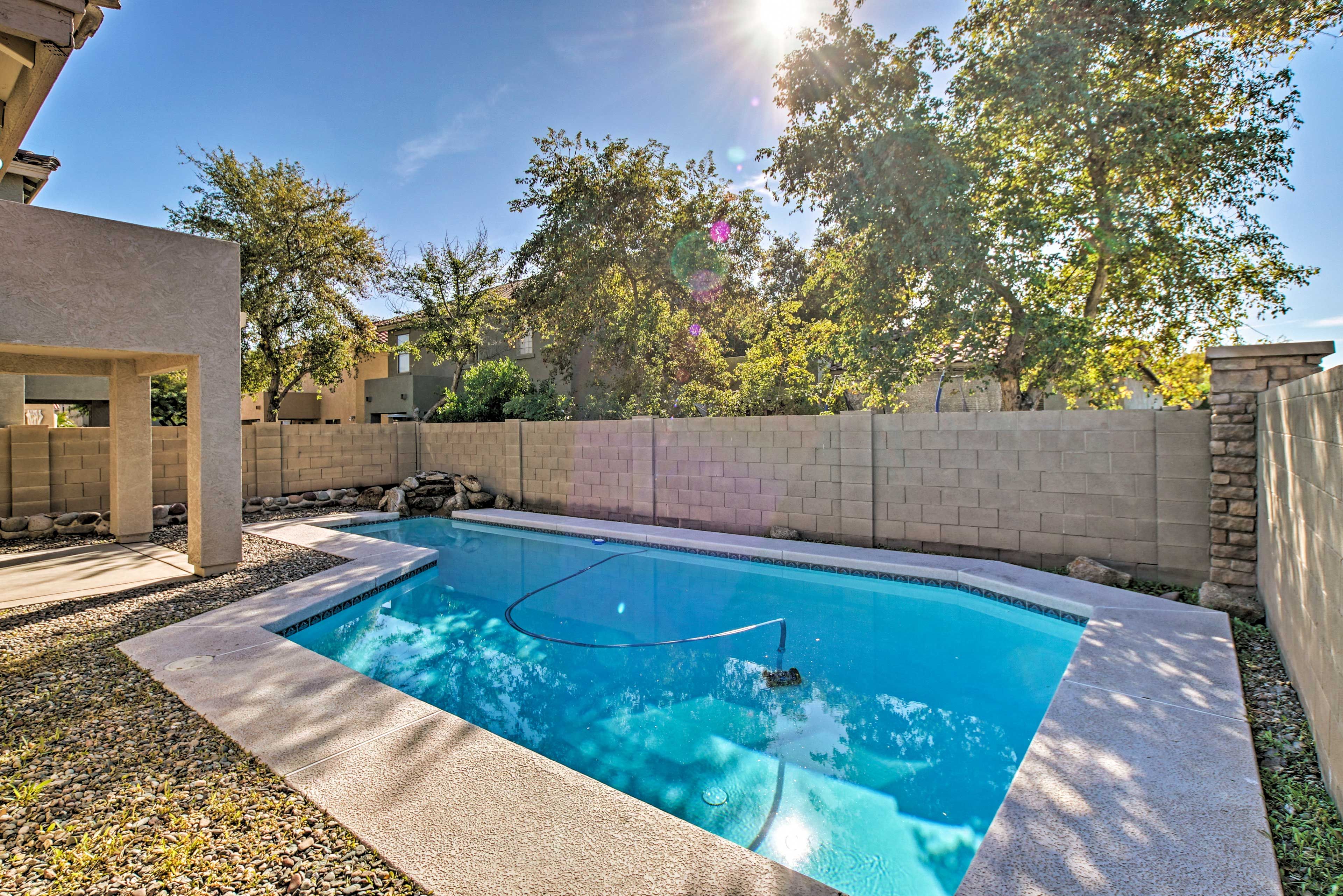 Step out back to enjoy a pool day.