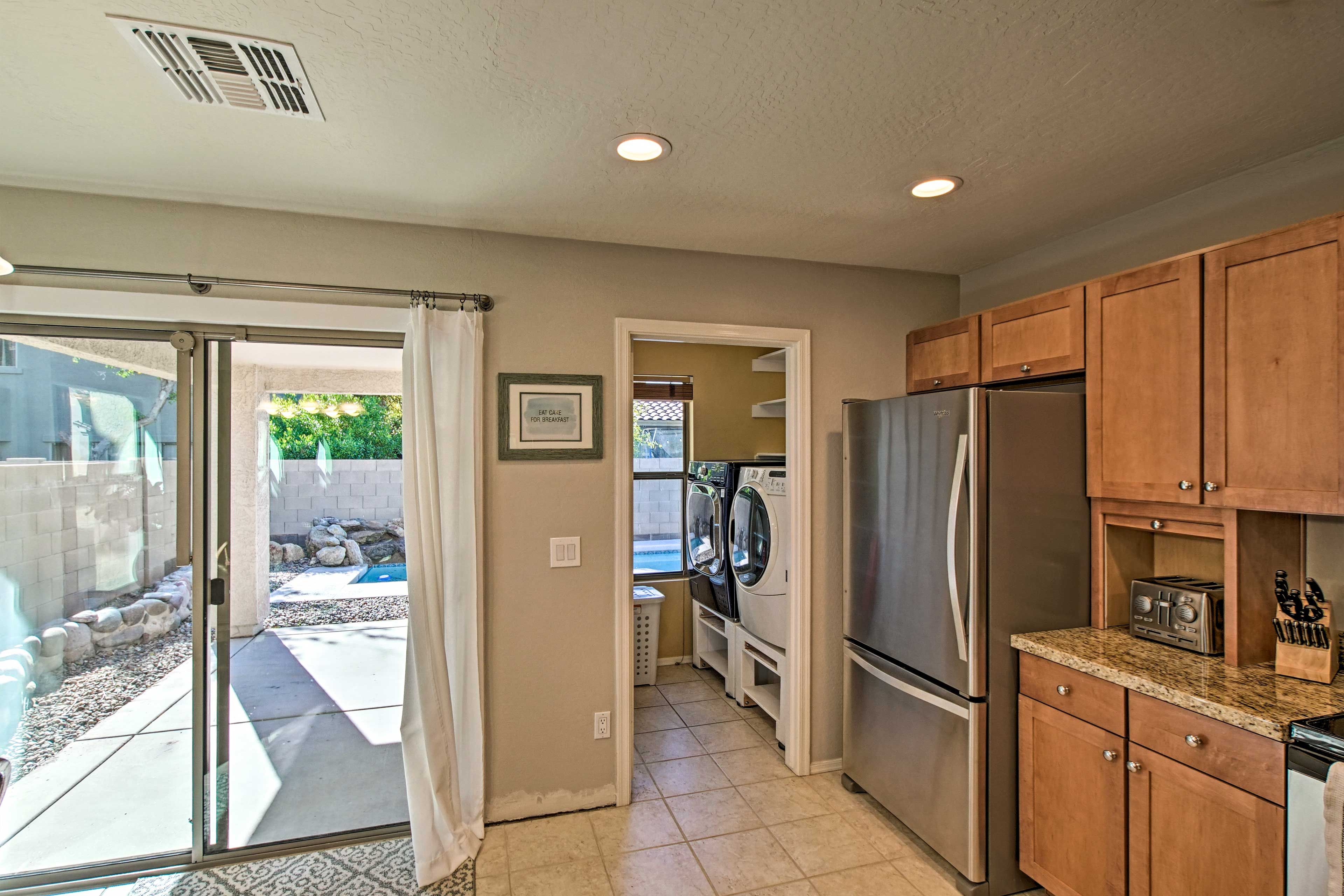 The laundry room is located just off the kitchen.