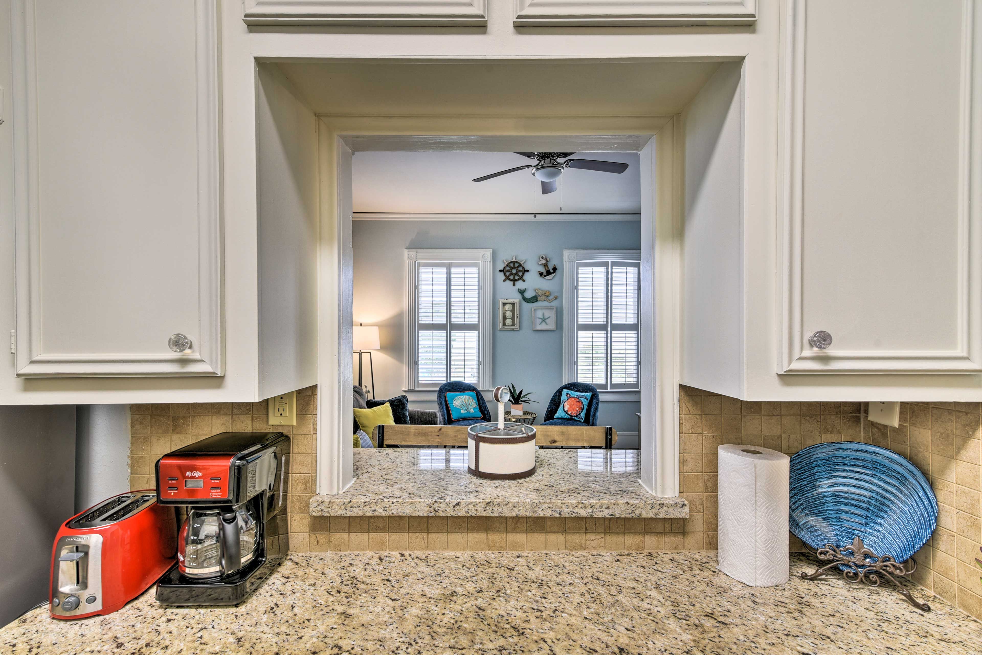 Granite counters top the bright kitchen.