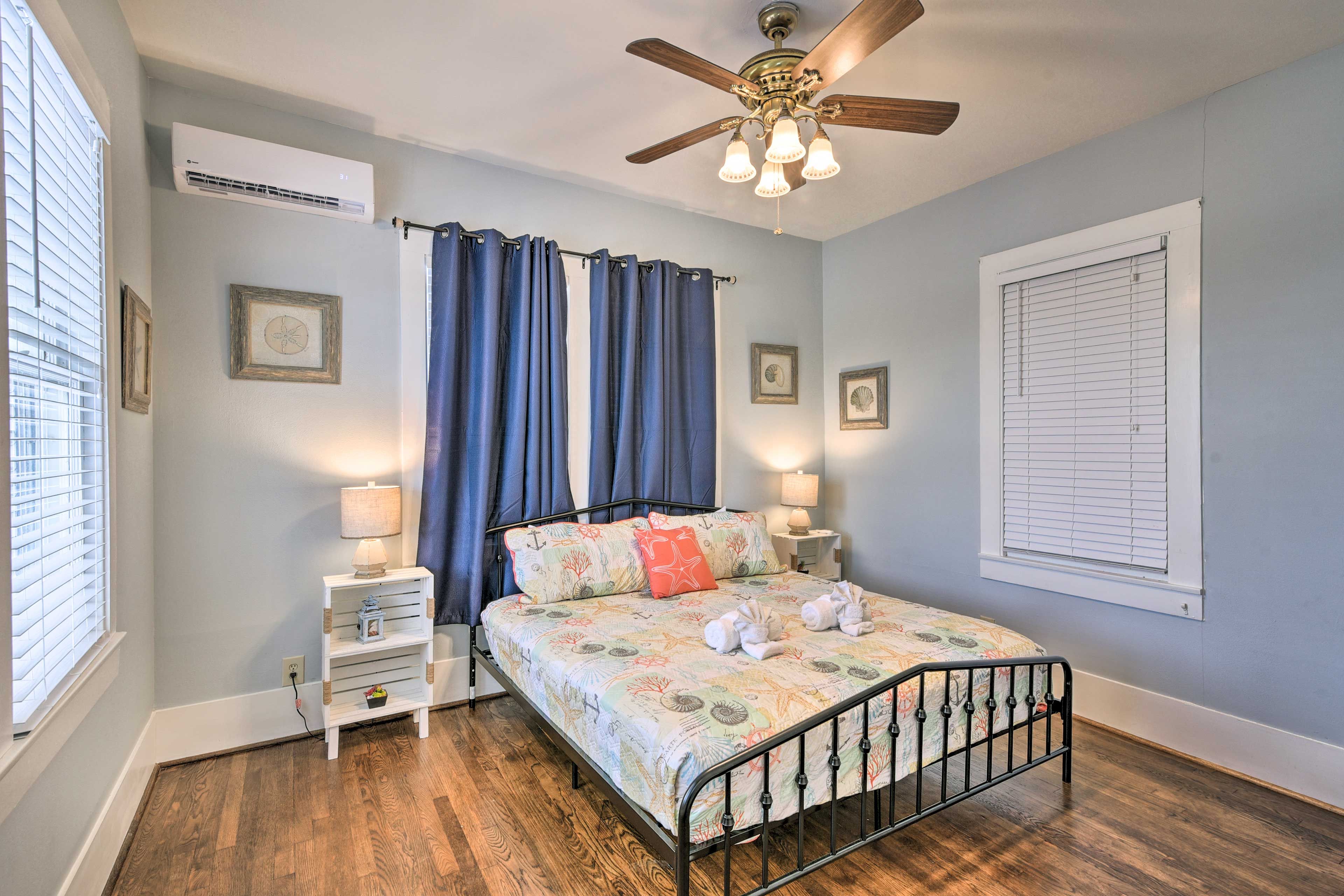 Airy and tastefully appointed, this bedroom features a queen bed.