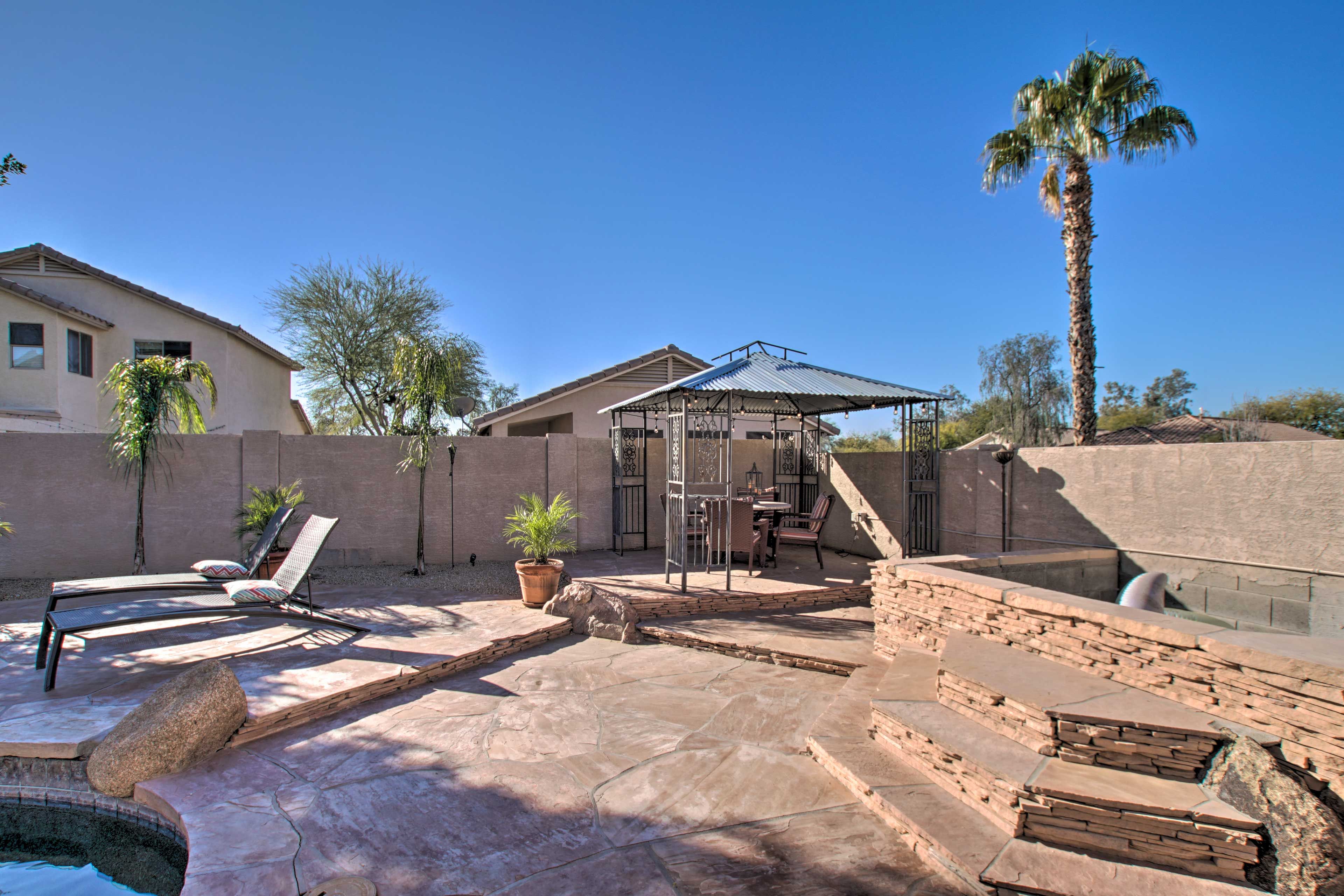 Catch some rays on the poolside sun chairs.